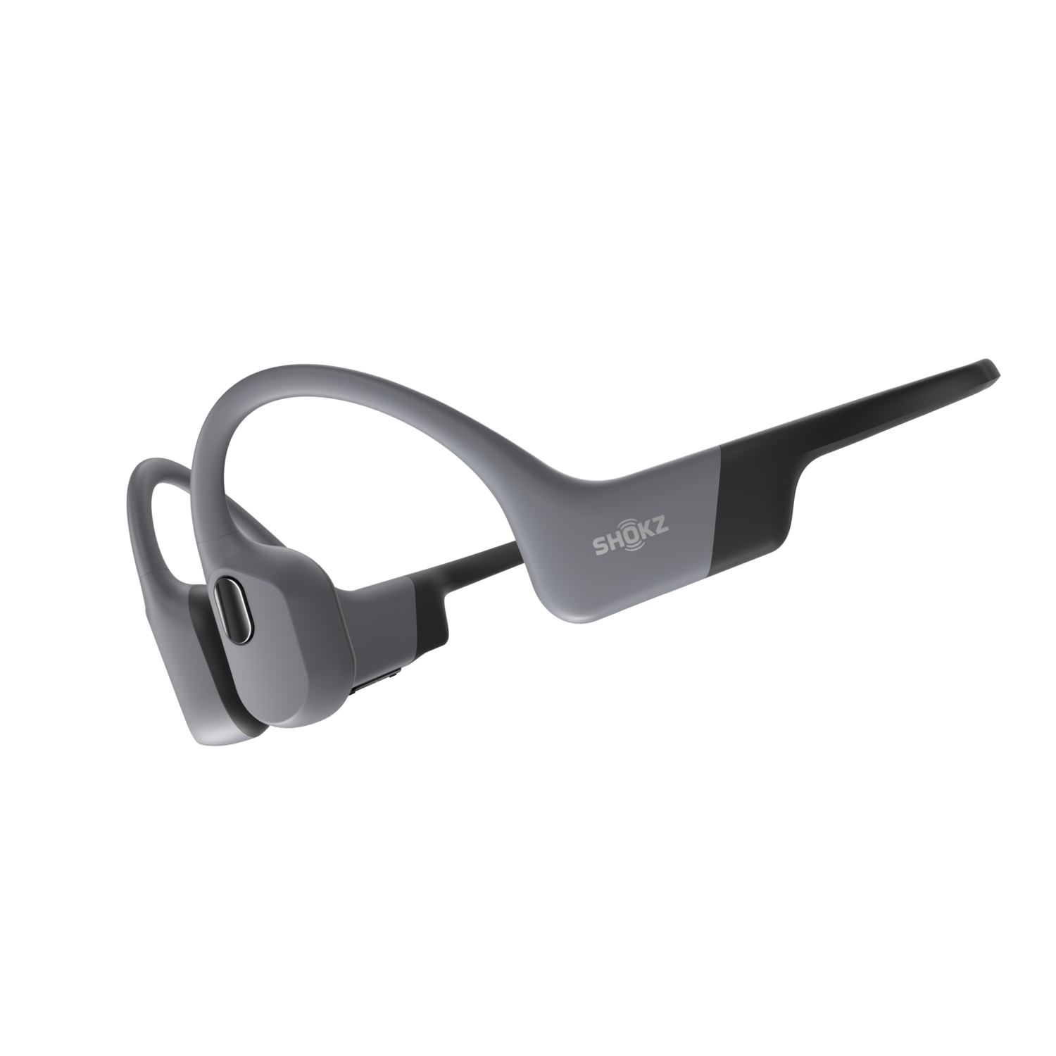 Gray Shokz bone conduction headphones. They wrap around the ear and rest on the cheekbones.