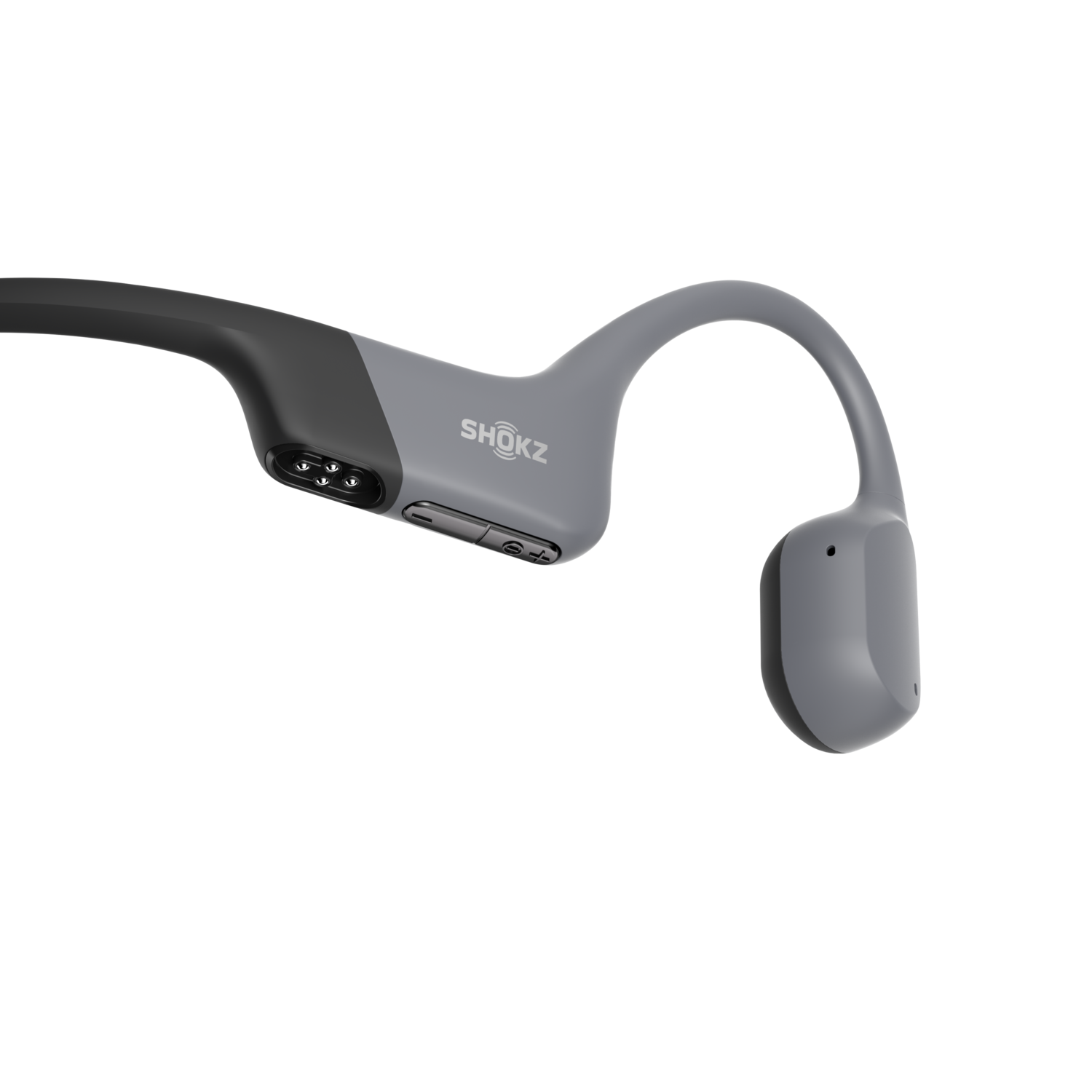 Gray Shokz bone conduction headphones, on a black background.