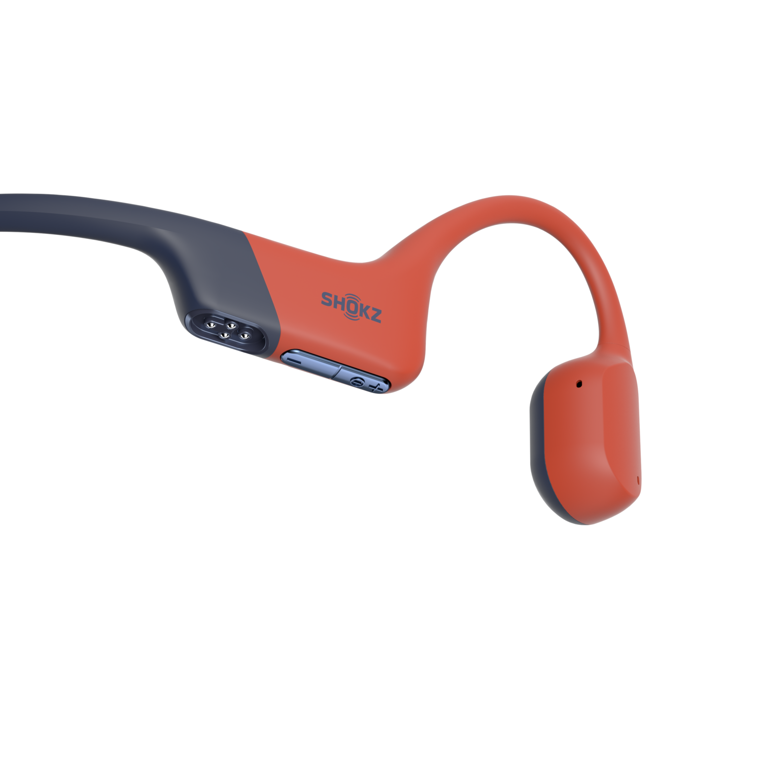 Orange and dark blue Shokz headphones, resting on a black surface. The brand name is visible.