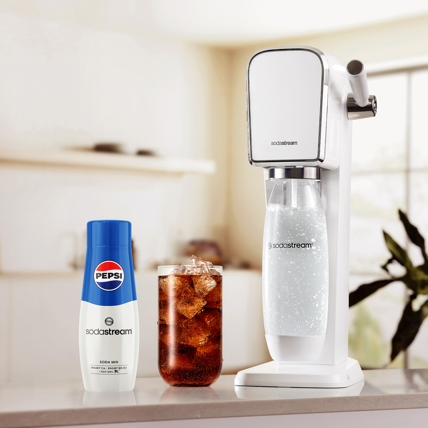 SodaStream, Pepsi soda mix bottle, and a glass of cola with ice.