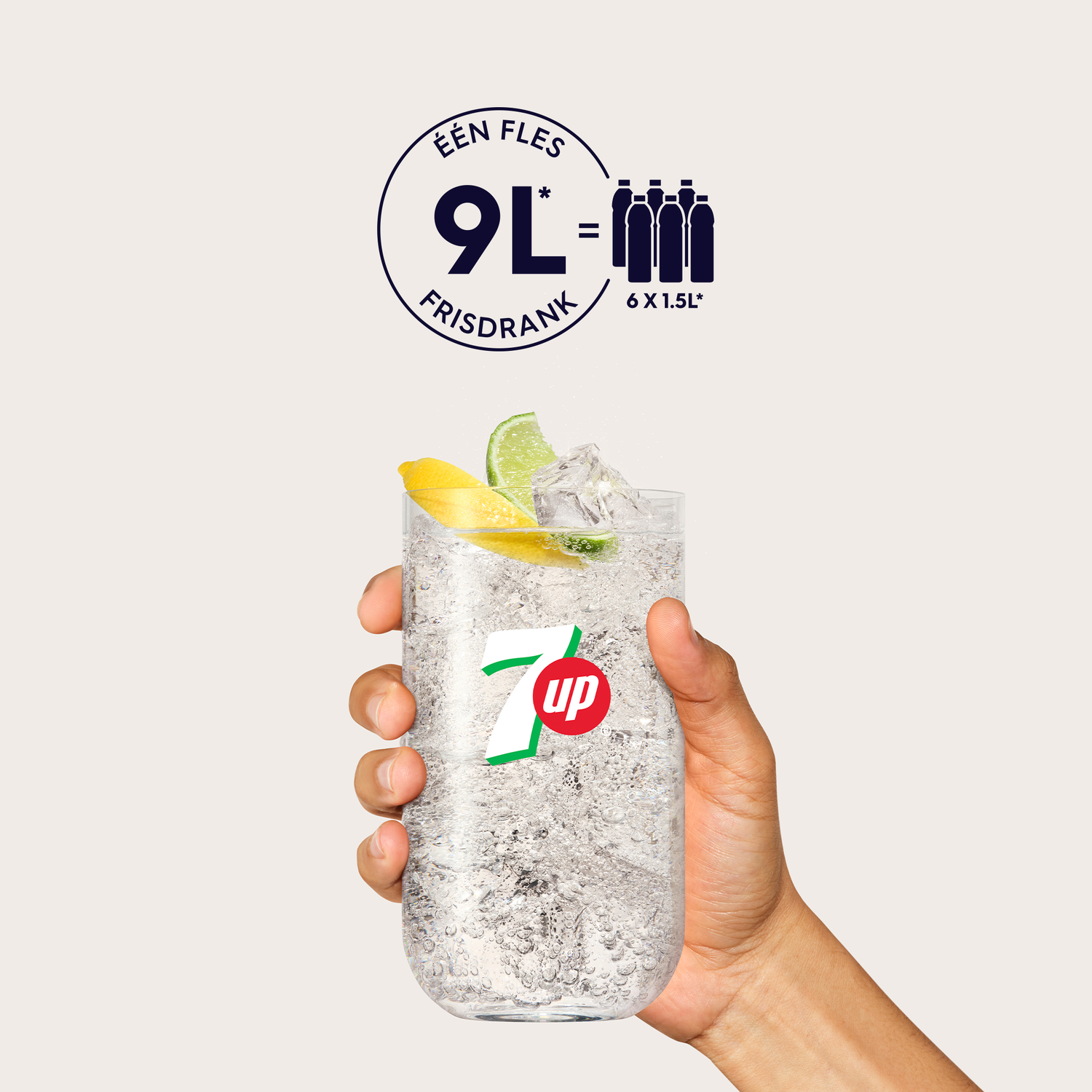 A hand holding a glass of 7 up with ice and lemon.