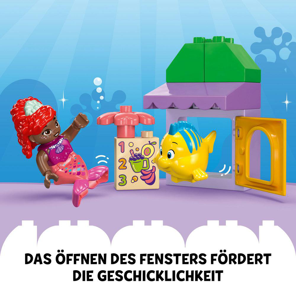 LEGO-Set mit einer Meerjungfrau, einem Fisch und einem Laden. Text sagt:
