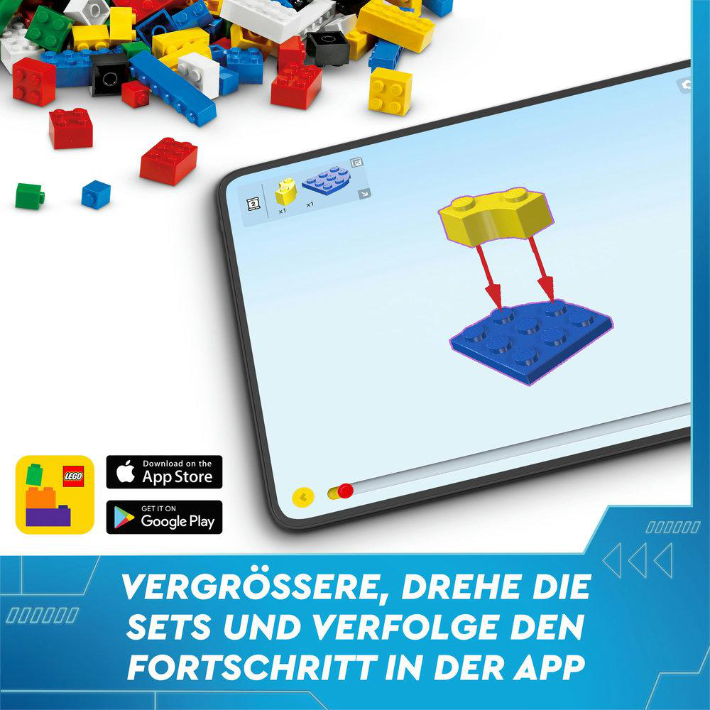 Ein digitales Tablet zeigt die Lego-Anleitung. Auf dem Bildschirm steht: 