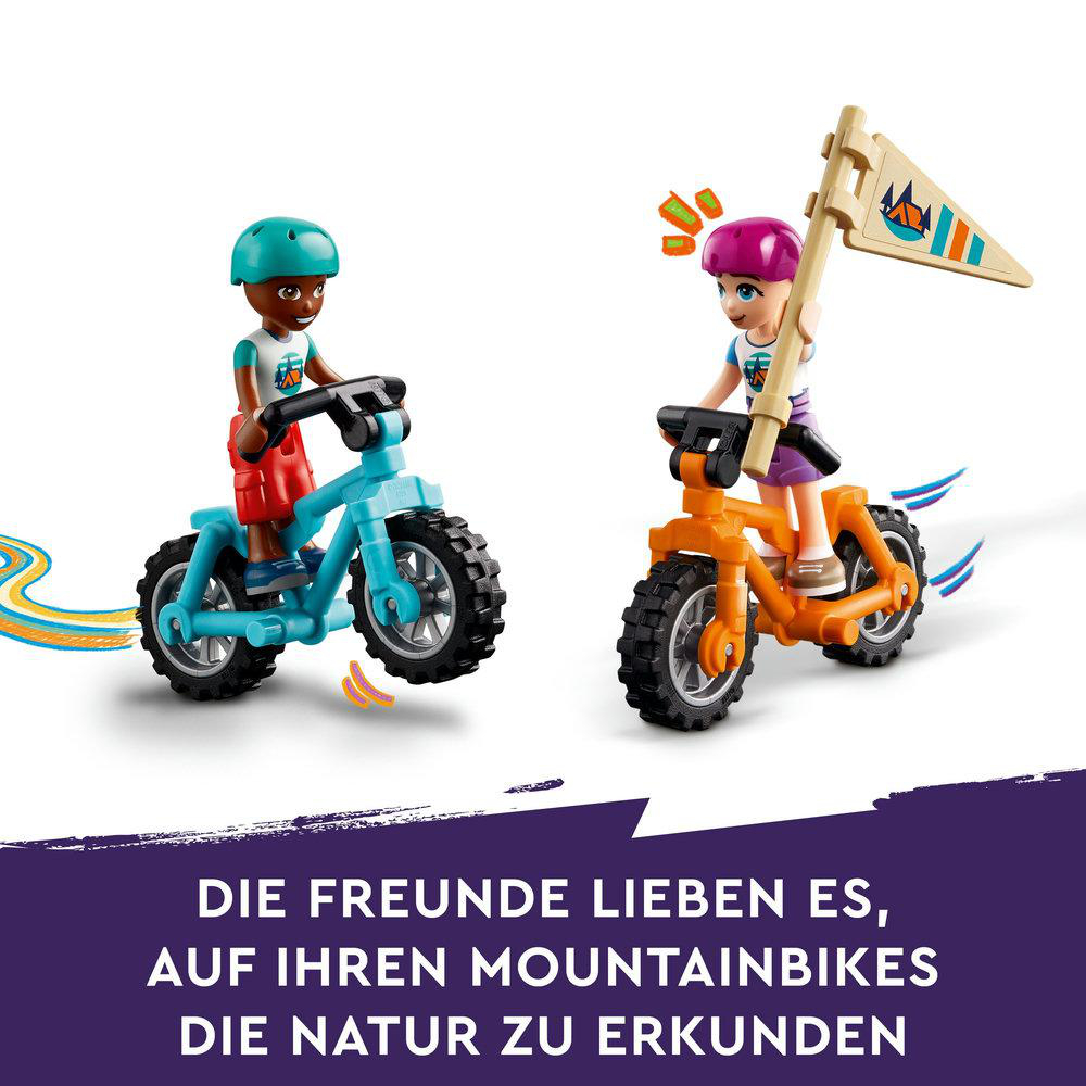 Lego Friends Szene: zwei Kinder auf Mountainbikes mit Fahnen. Blaue und orange Fahrräder.