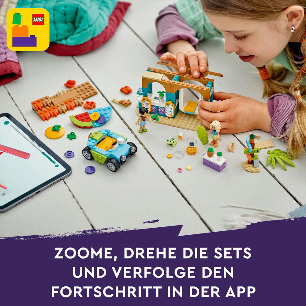Ein Mädchen spielt mit einem Lego-Set, ein Tablet ist im Vordergrund.