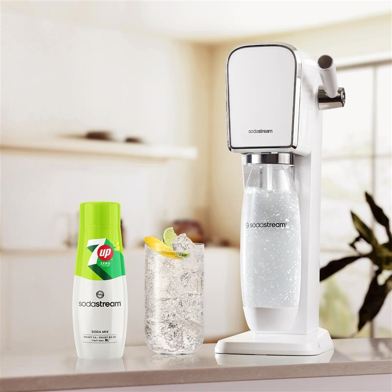 A white soda machine with soda bottles.