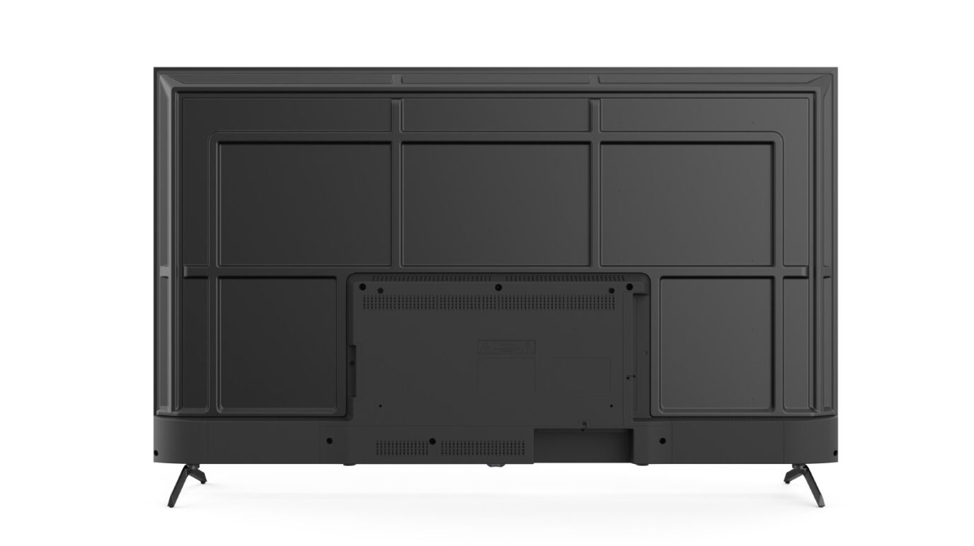 Parte trasera de un televisor negro con puertos y un diseño de rejilla.