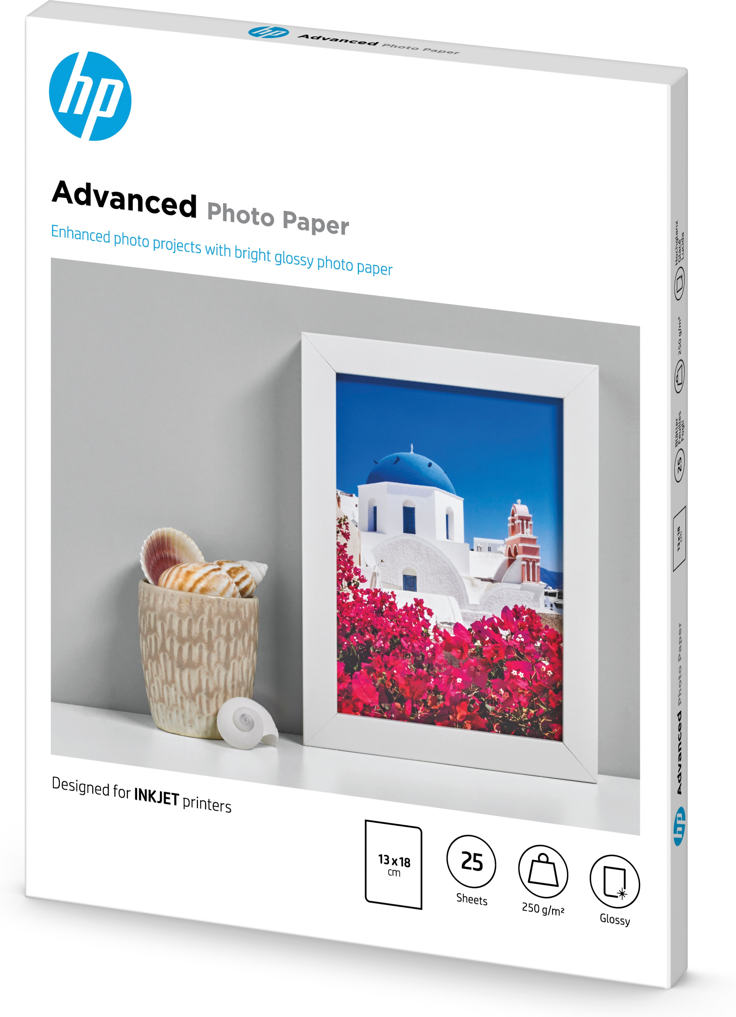 Eine Schachtel Fotopapier mit einem gerahmten Bild eines Gebäudes mit blauer Kuppel und Blumen.