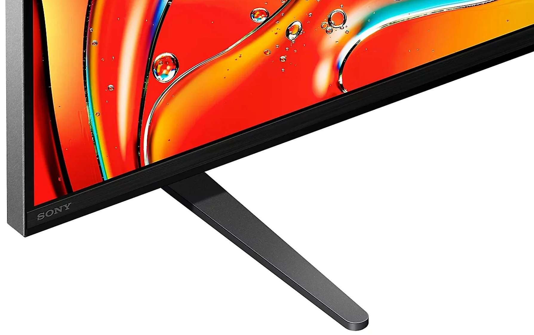 Ekran telewizora z kolorowym, abstrakcyjnym obrazem, wspierany przez czarny stojak.