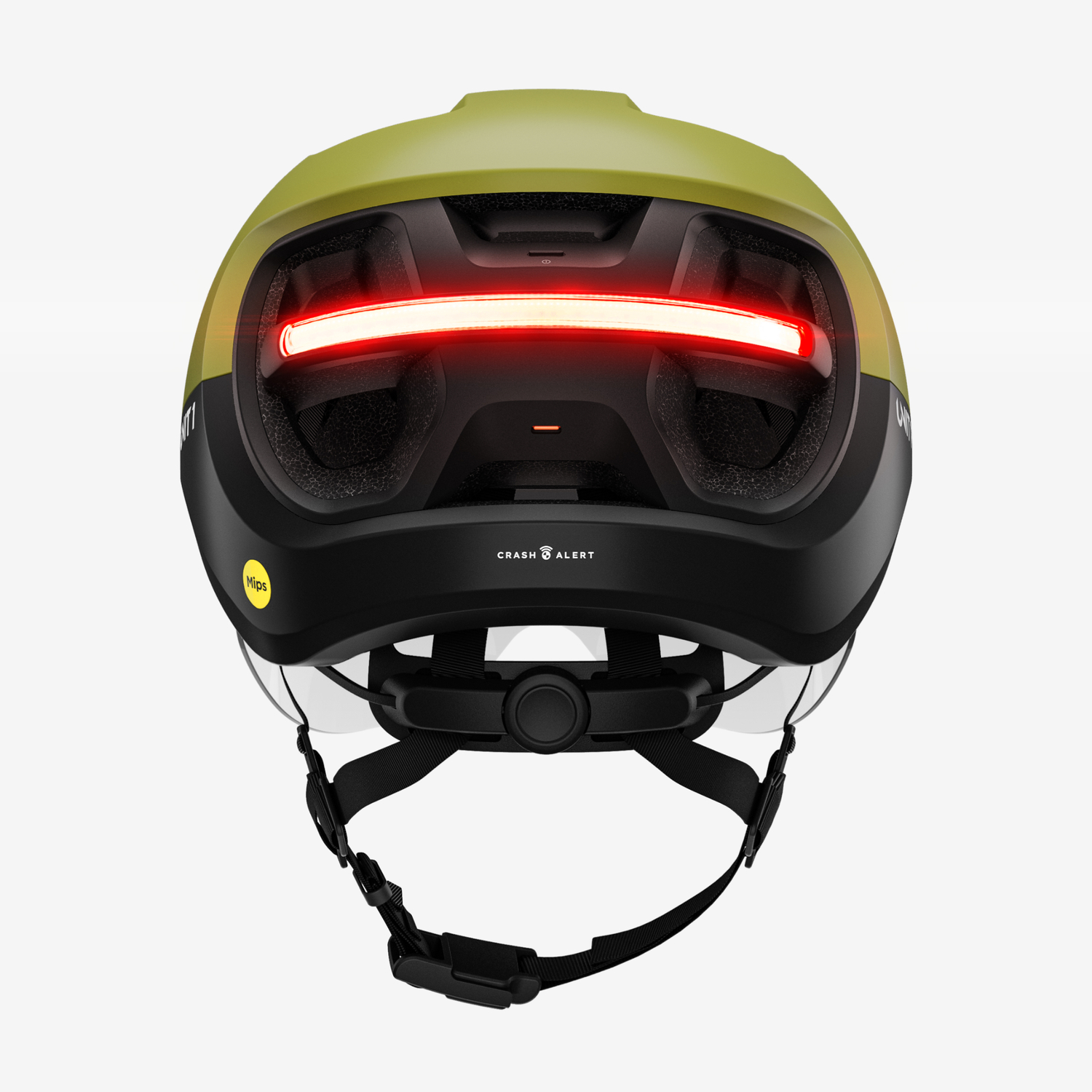 Een groene en zwarte helm met een rode lichtbalk, met 'CRASH ALERT' en 'Mips'.