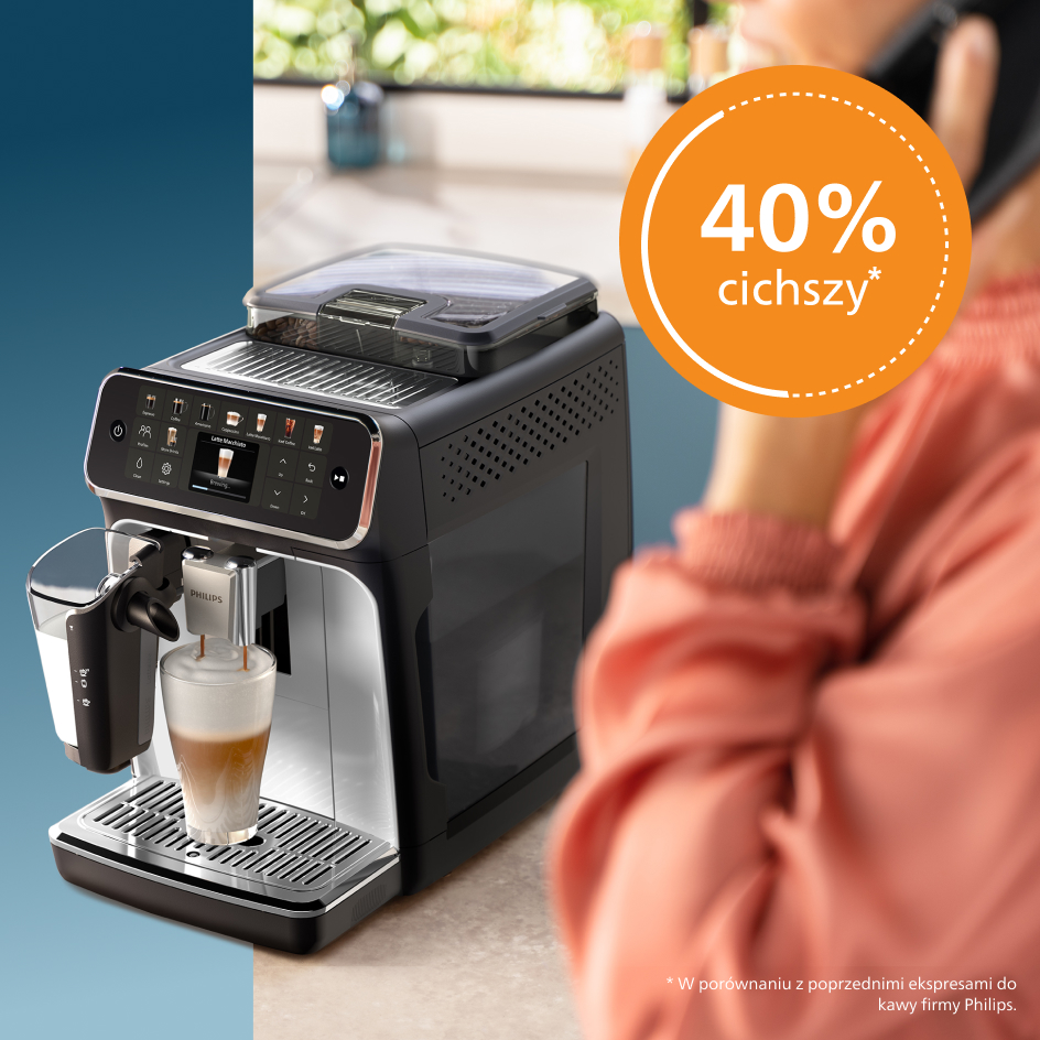 Ekspres do kawy z szklanką kawy. W tle kobieta rozmawia przez telefon.