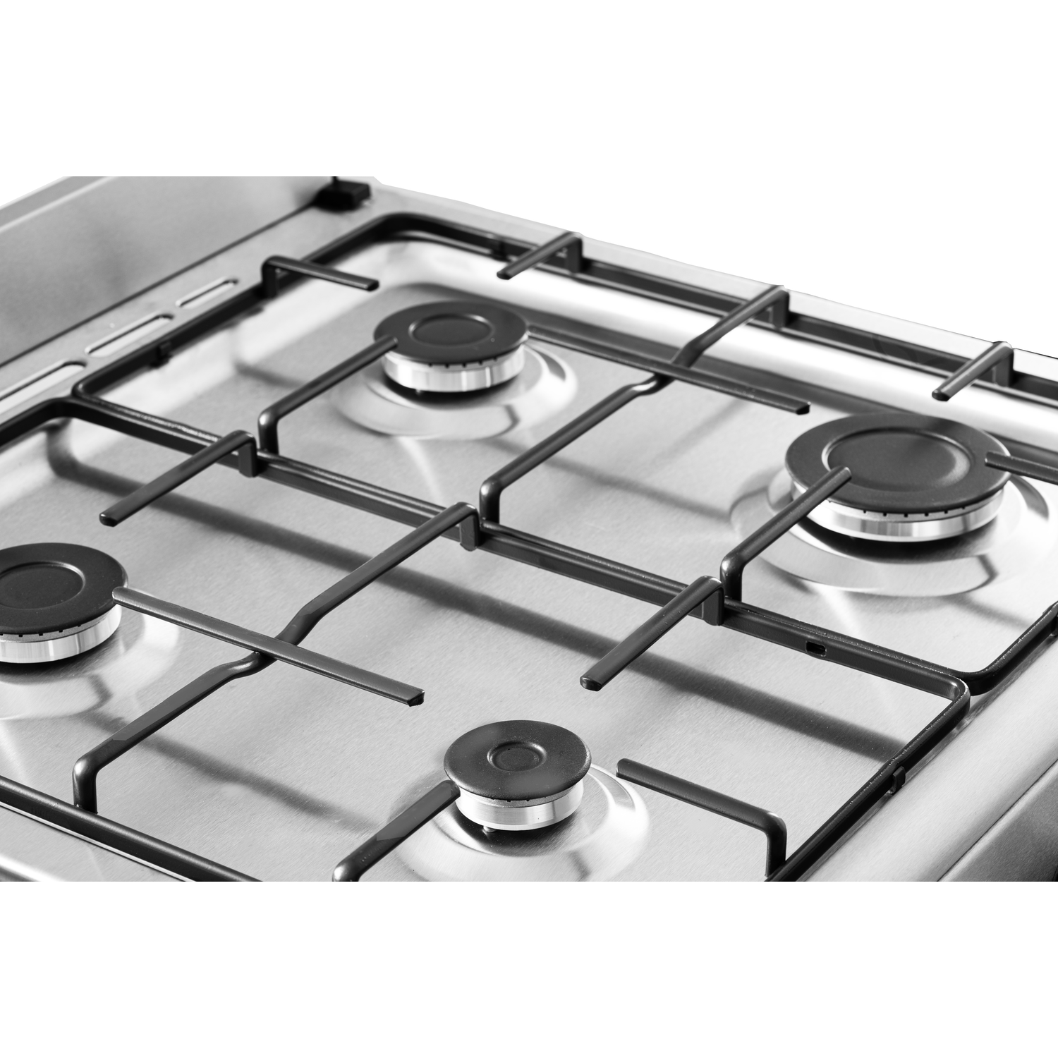Close-up of a stainless steel gas stove. Four burners, black supports, and metal surface.