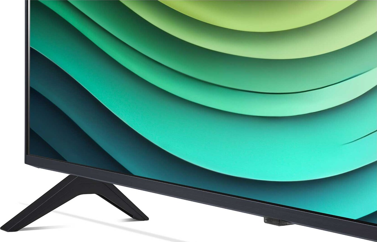 Nahaufnahme eines Fernsehers mit grünem und blauem wellenförmigen Bildschirmmuster. Der Fernseher hat schwarze Beine.