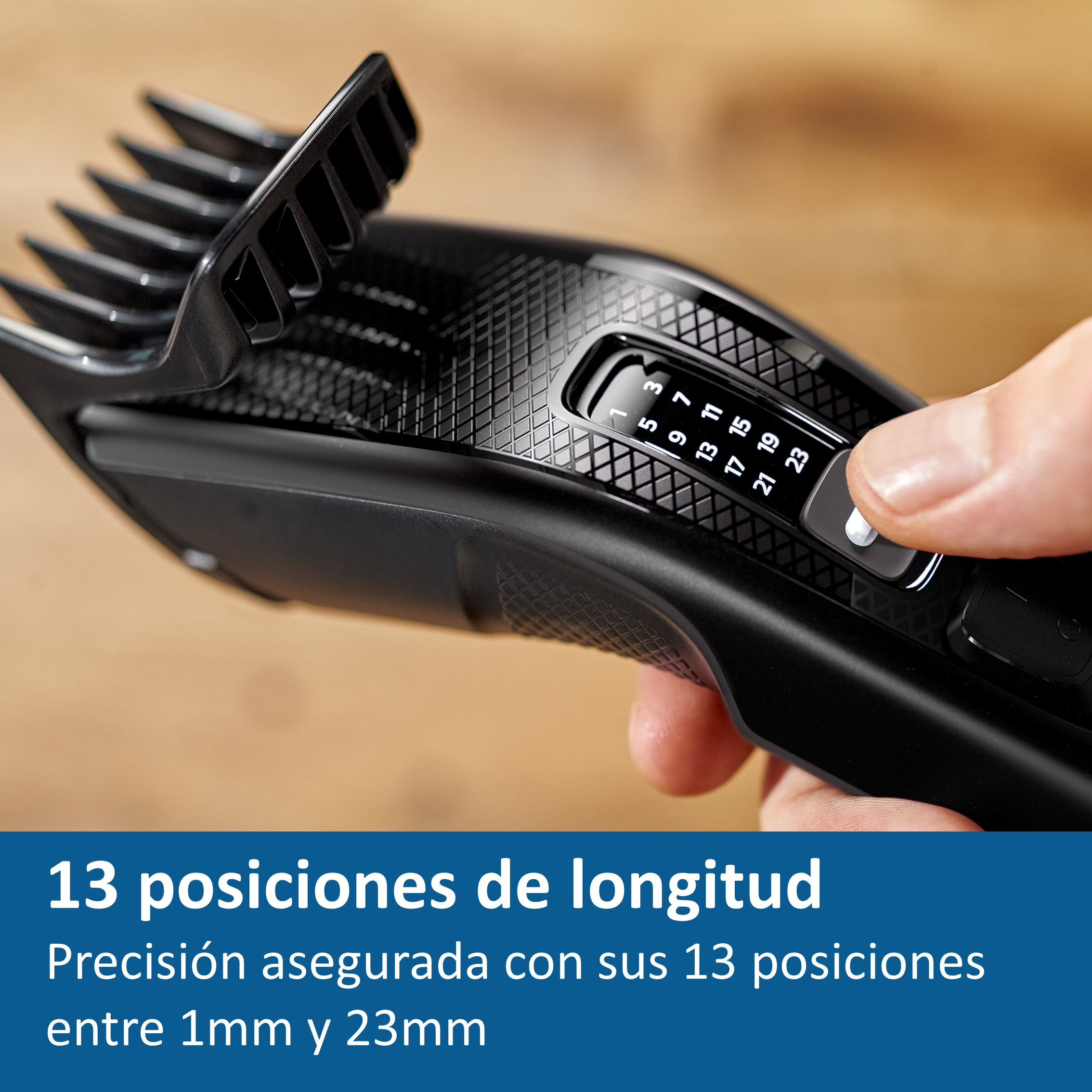 Una cortadora de pelo negra con un dial que muestra los ajustes de longitud.