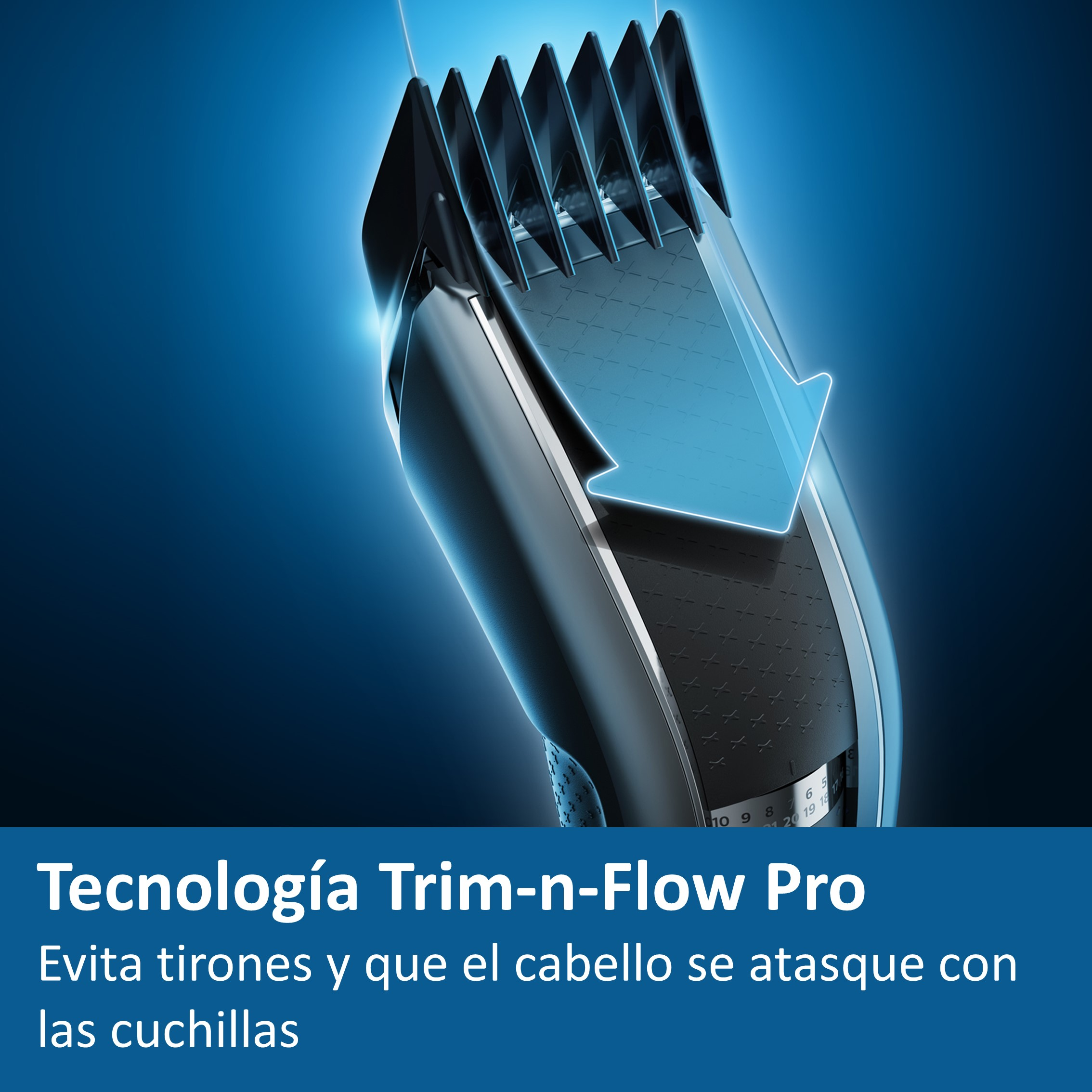 Primer plano de una cortadora de cabello negra y plateada con una flecha azul que indica la dirección del flujo del cabello.