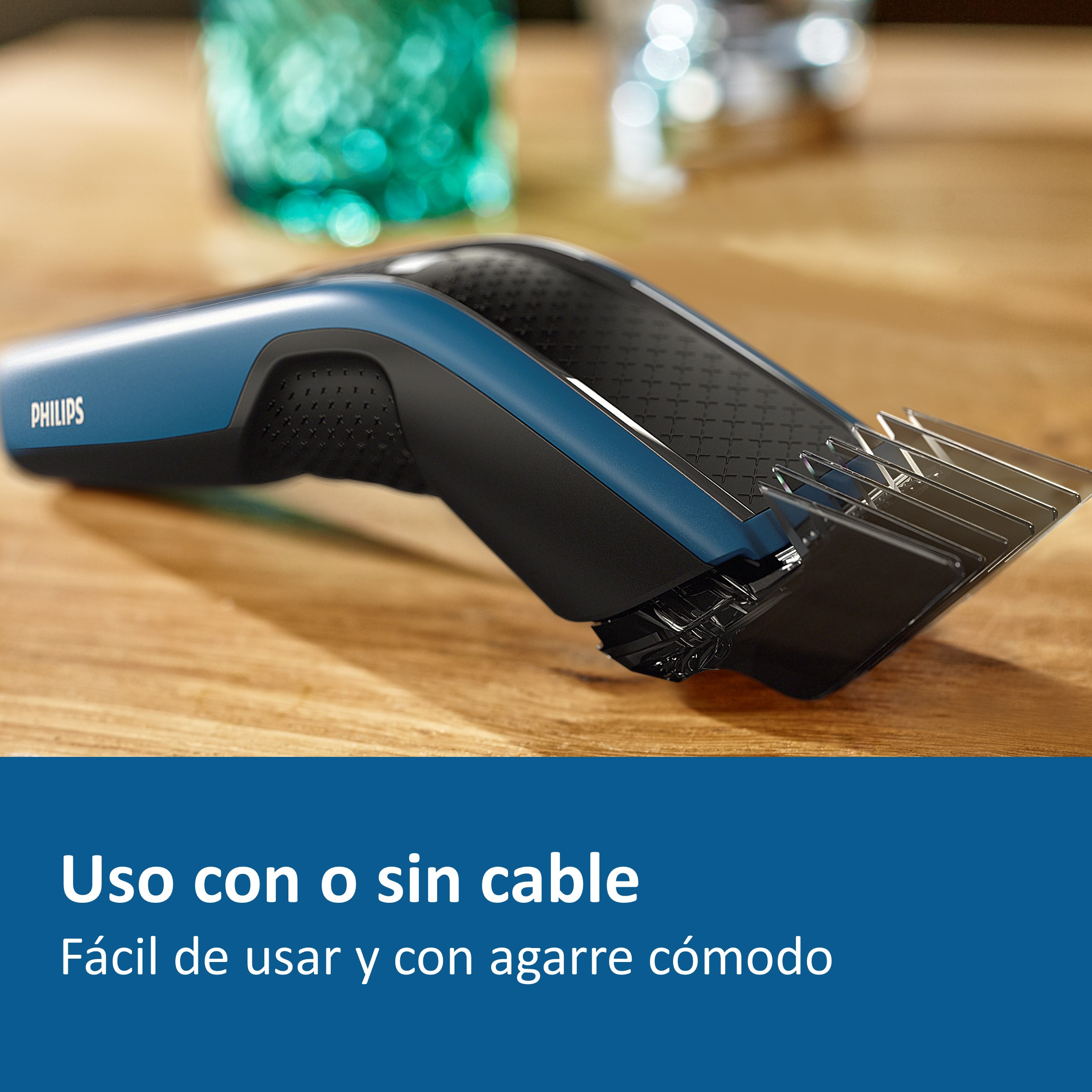 Cortapelos negro y azul sobre una superficie de madera, con texto debajo.