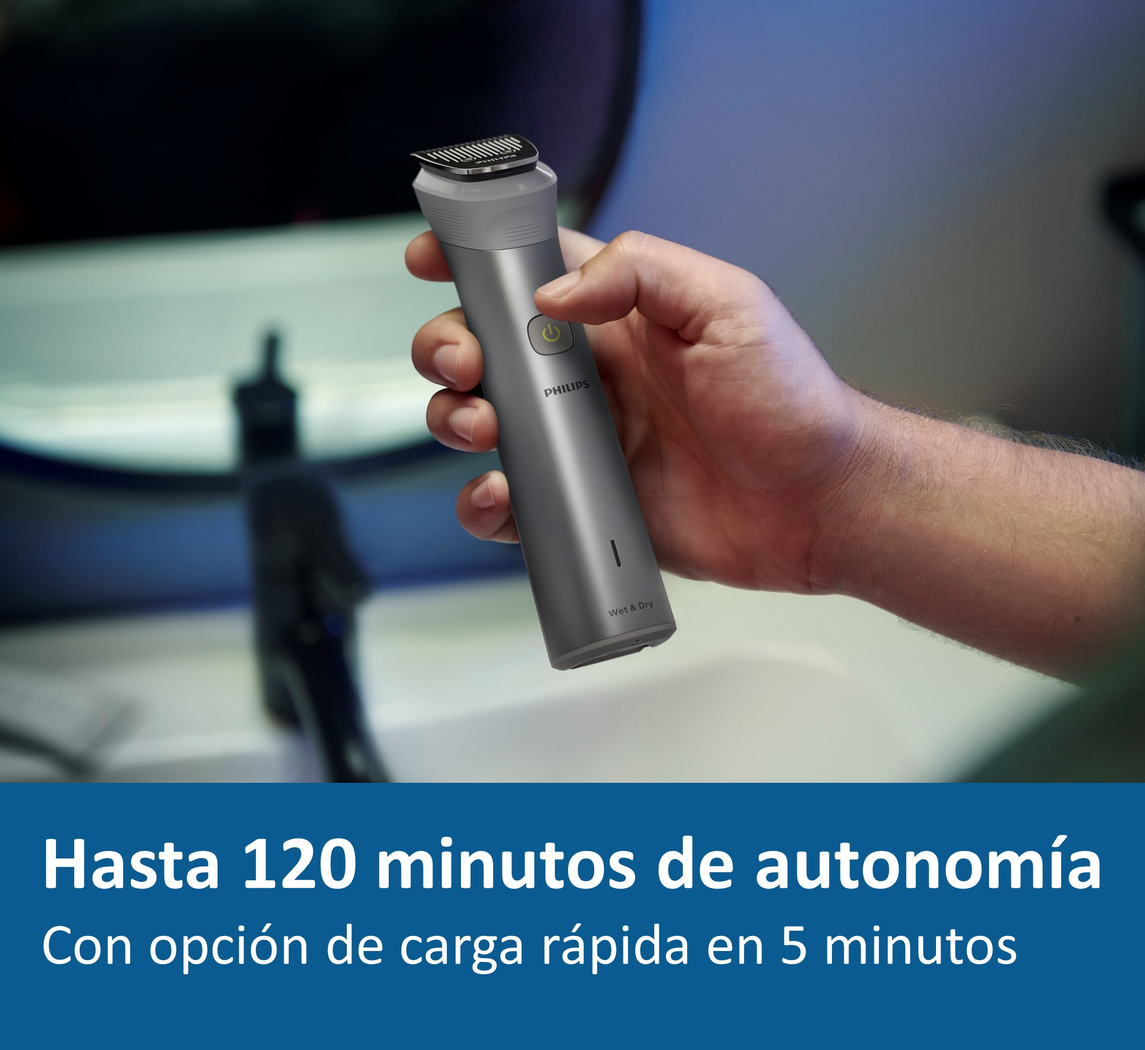 Una mano sosteniendo una afeitadora Philips gris, con texto sobre la duración de la batería y la carga.