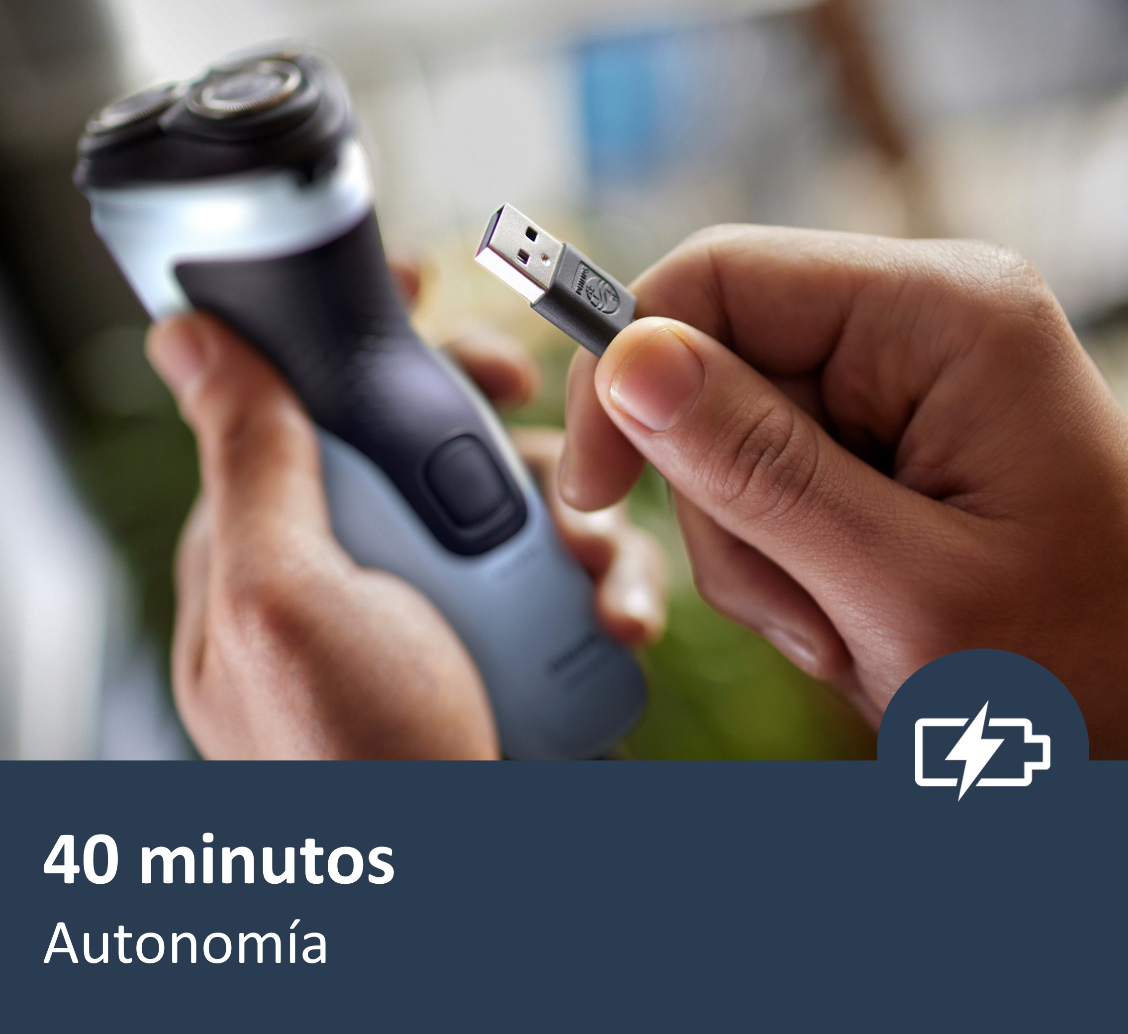 Una afeitadora con cable de carga USB. El texto dice '40 minutos' y 'Autonomía'.