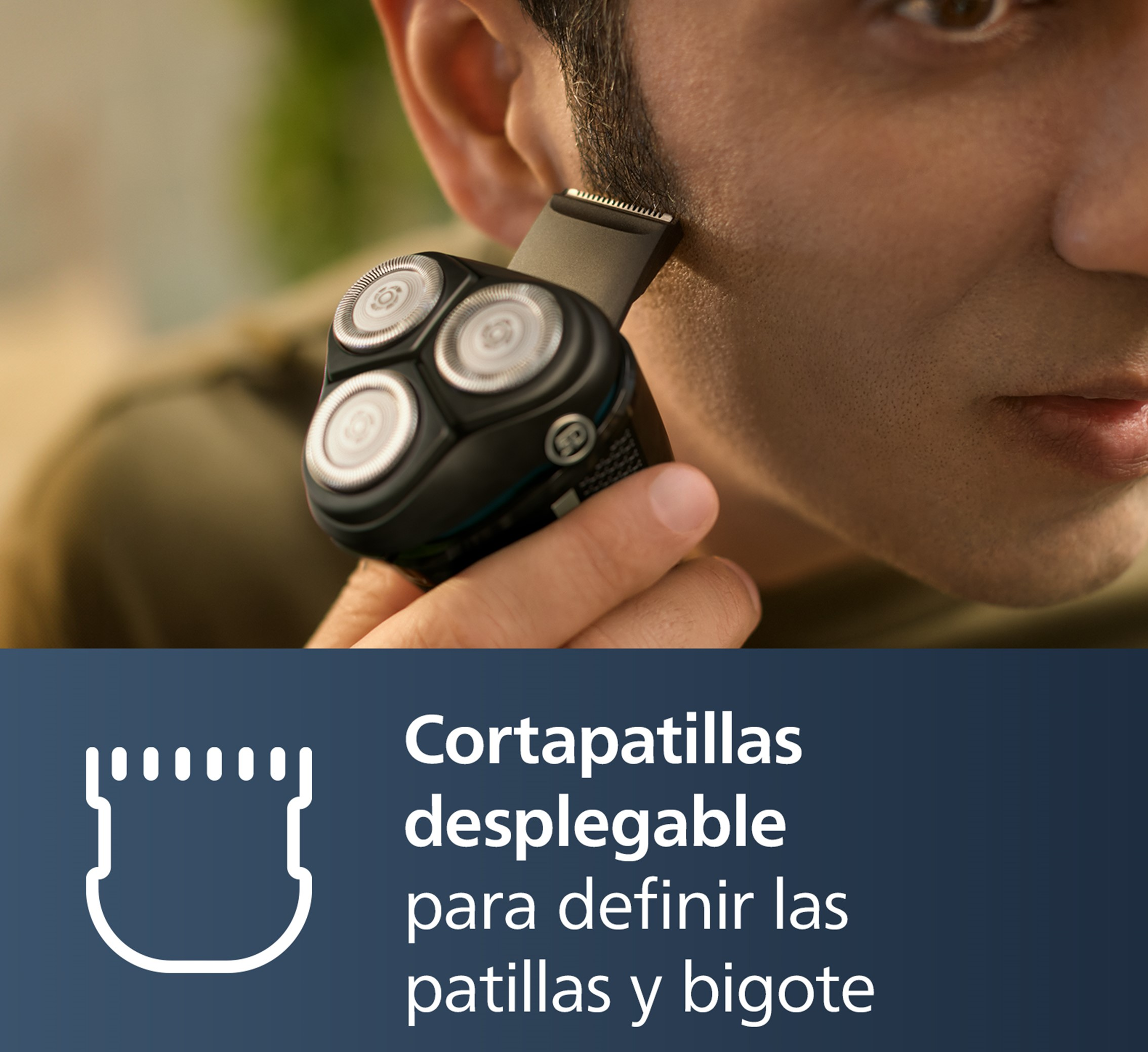 Hombre usando un recortador Philips para dar forma a sus patillas. Primer plano del recortador y la cara del hombre.