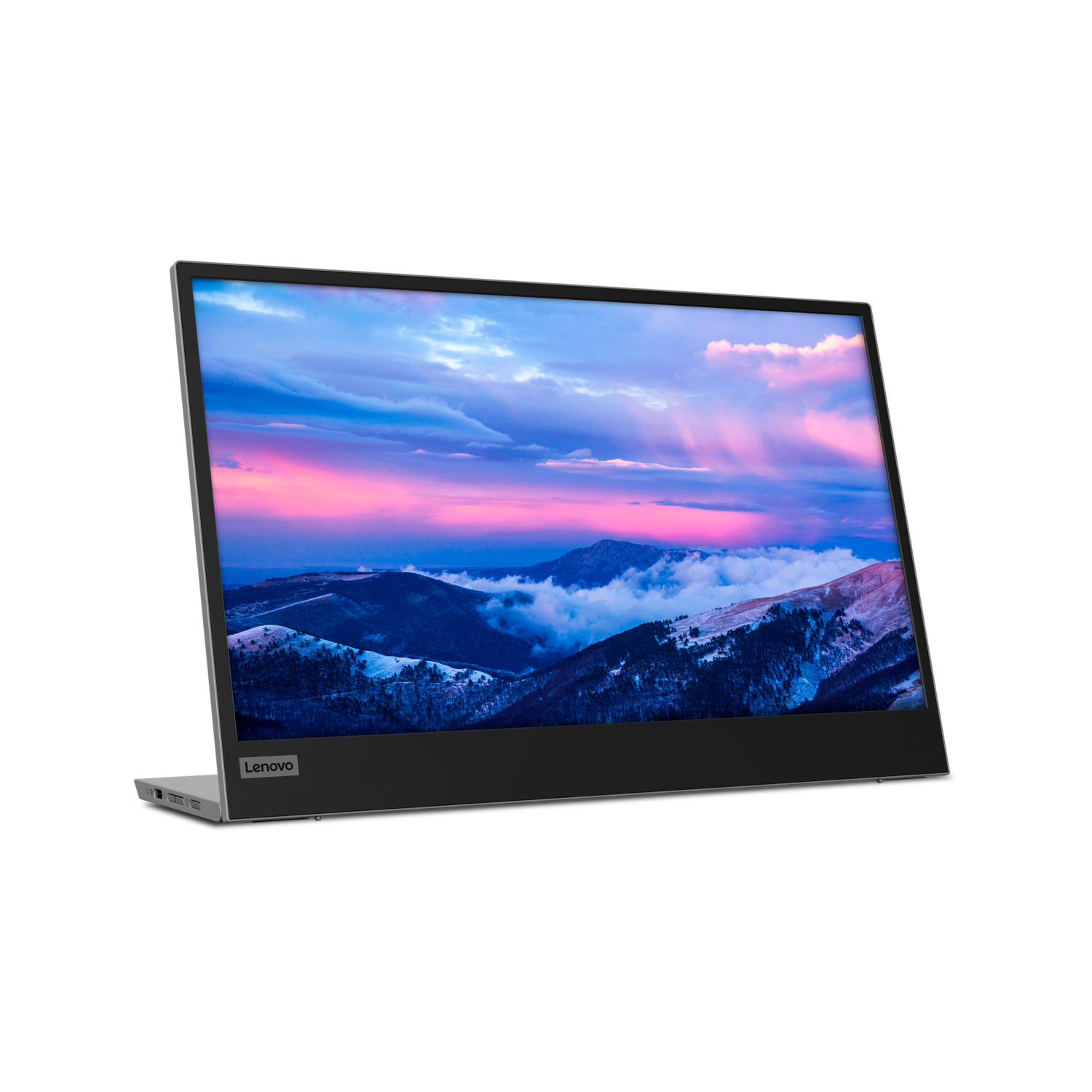 Laptop on a white surface, screen displays a mountain landscape with a colorful sky.