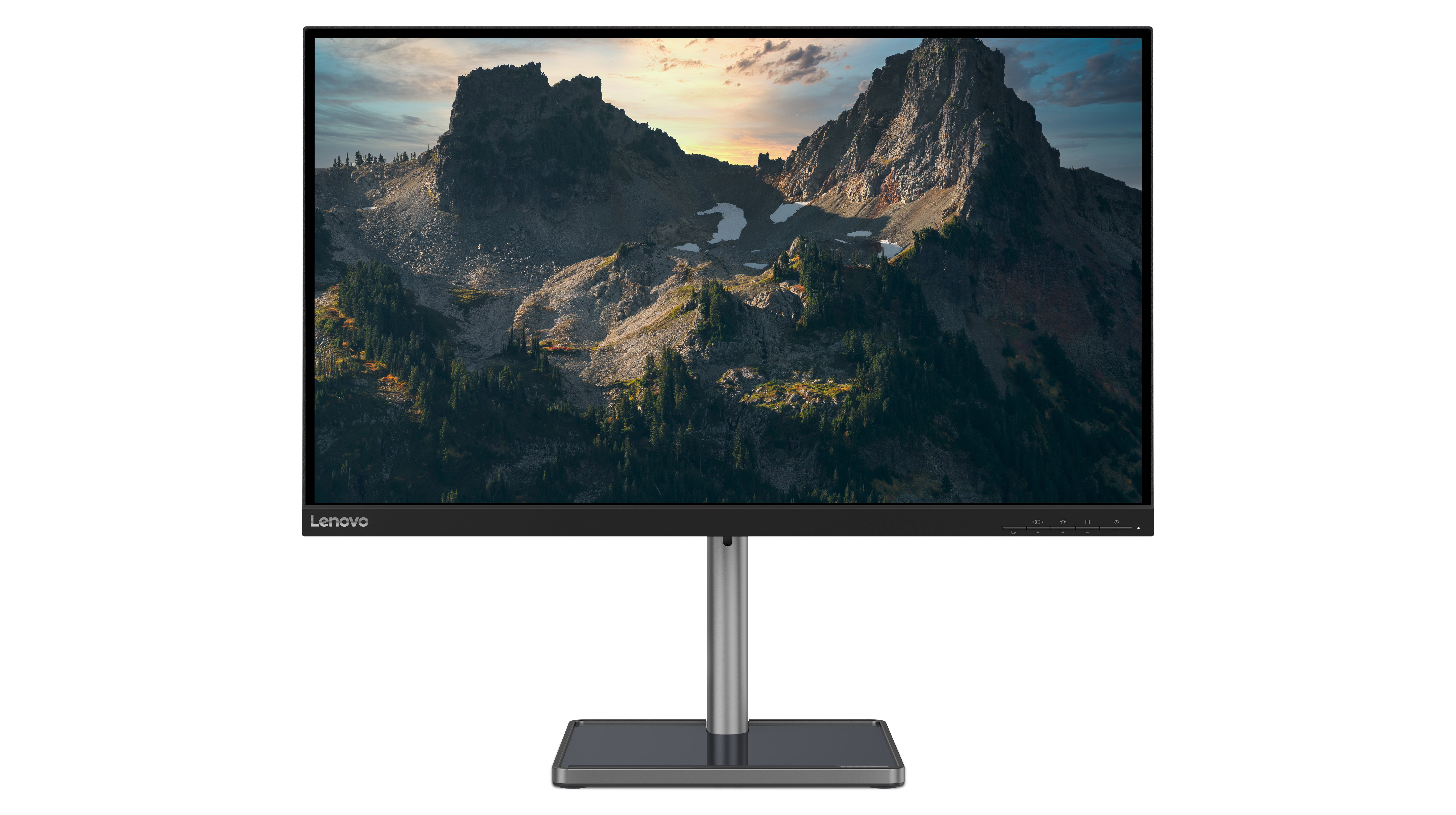 Monitor komputerowy Lenovo. Ekran pokazuje górski krajobraz o zachodzie słońca.