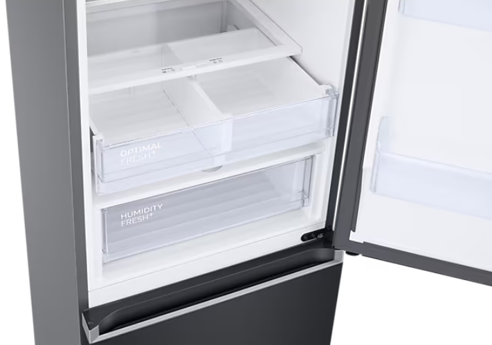 Otwarta lodówka pokazująca przezroczyste szuflady z etykietami 'Optimal Fresh+' i 'Humidity Fresh+'.