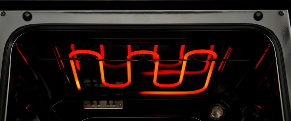 Oven interior with red heating elements.