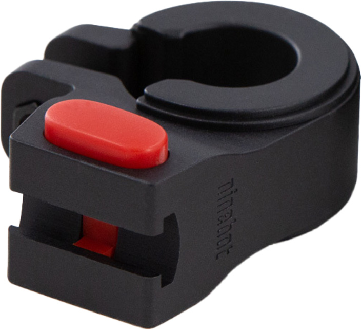 Un accessorio nero per bicicletta con un pulsante rosso.