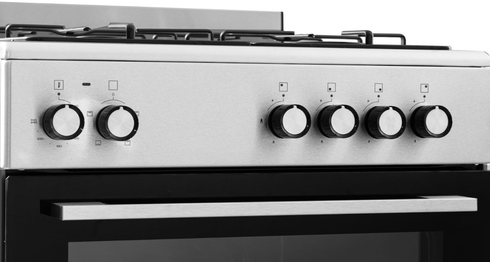 Stainless steel stove with knobs and oven door. Black and white.
