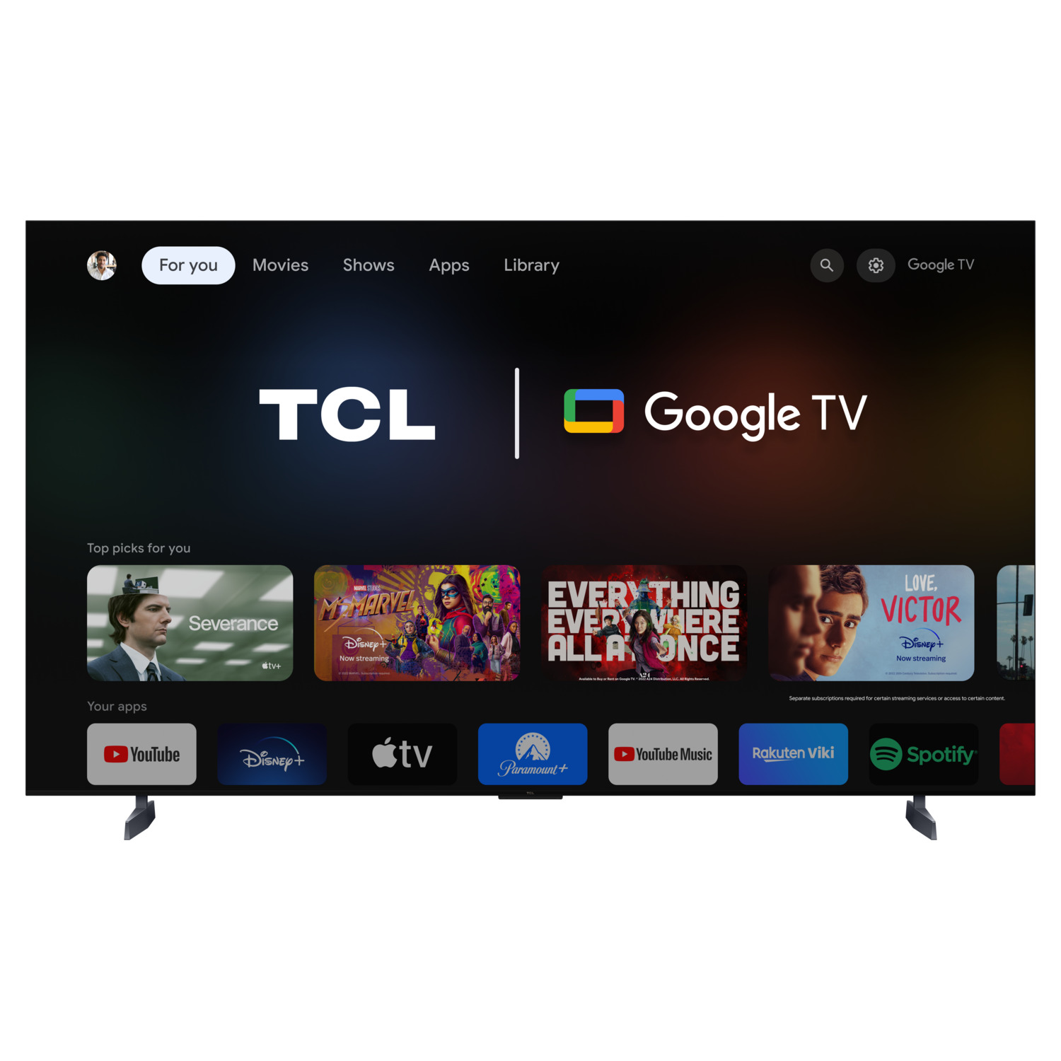 TCL Google TV scherm. Toont apps en shows. Zwart frame en standaard.