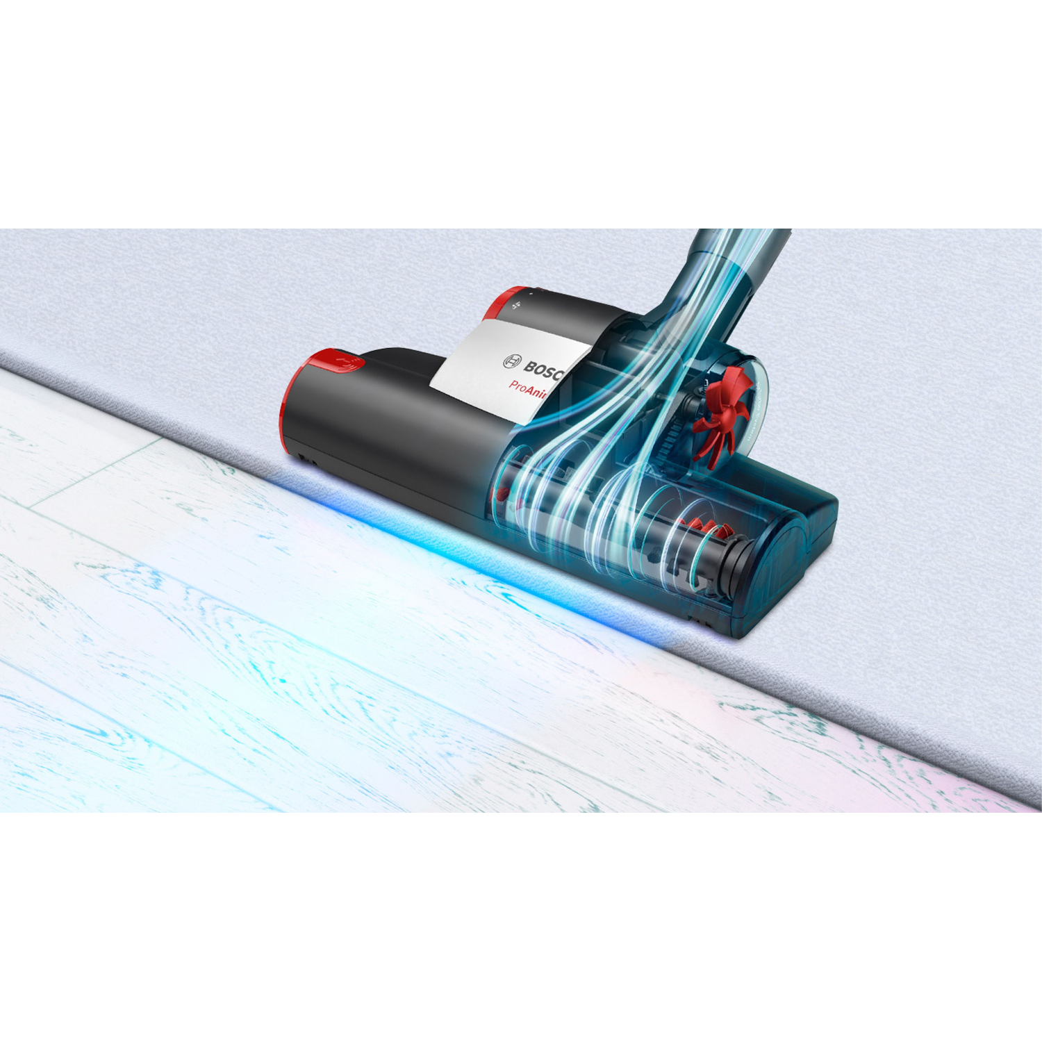 Vacuum cleaner head close up. A blue light shines on the floor, with the machine's parts visible.