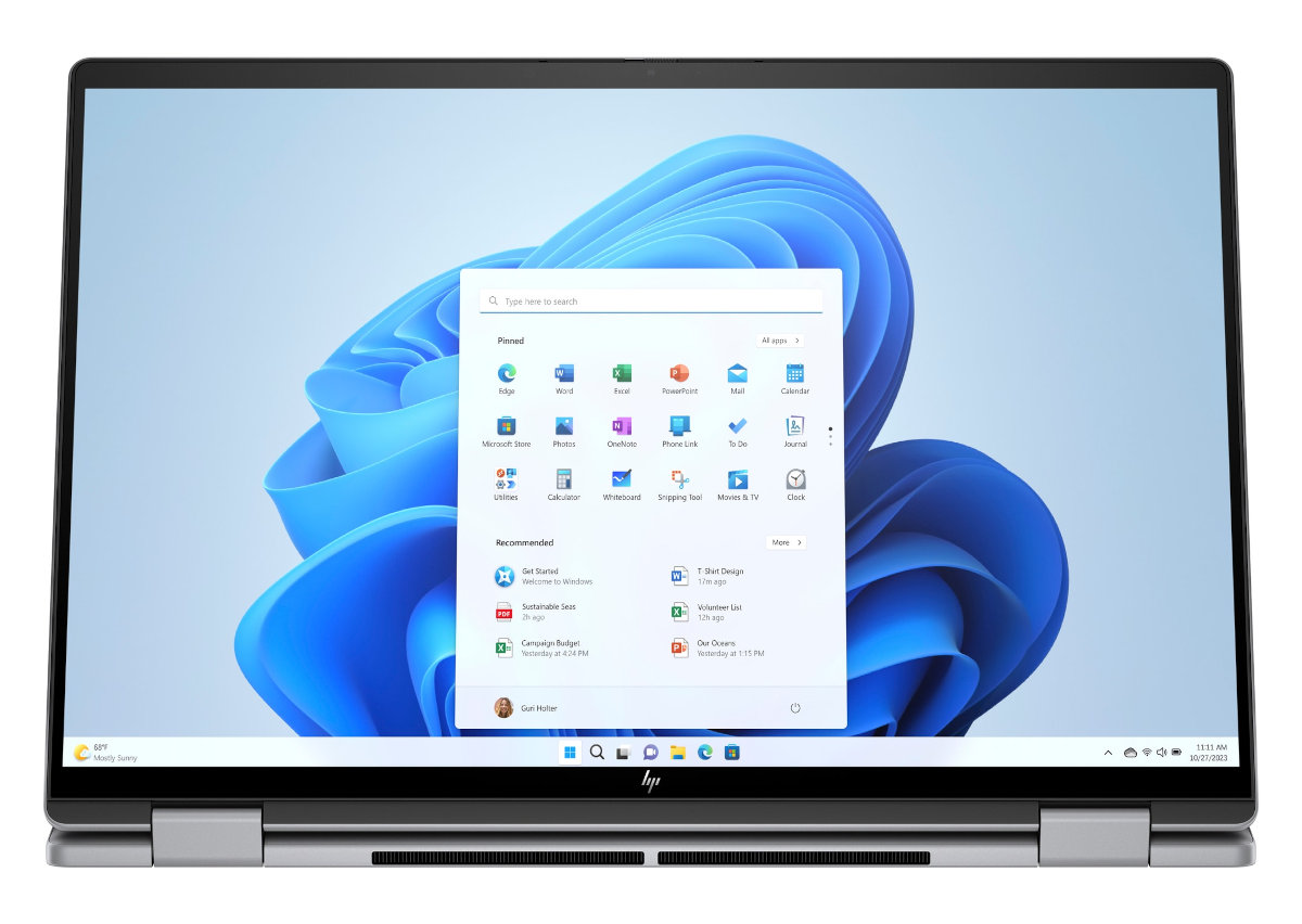 Laptop pokazujący pulpit Windows 11 z ikonami aplikacji.