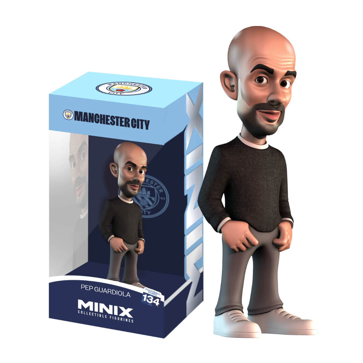 Statuetta di Pep Guardiola in una scatola del Manchester City, con la statuetta accanto.
