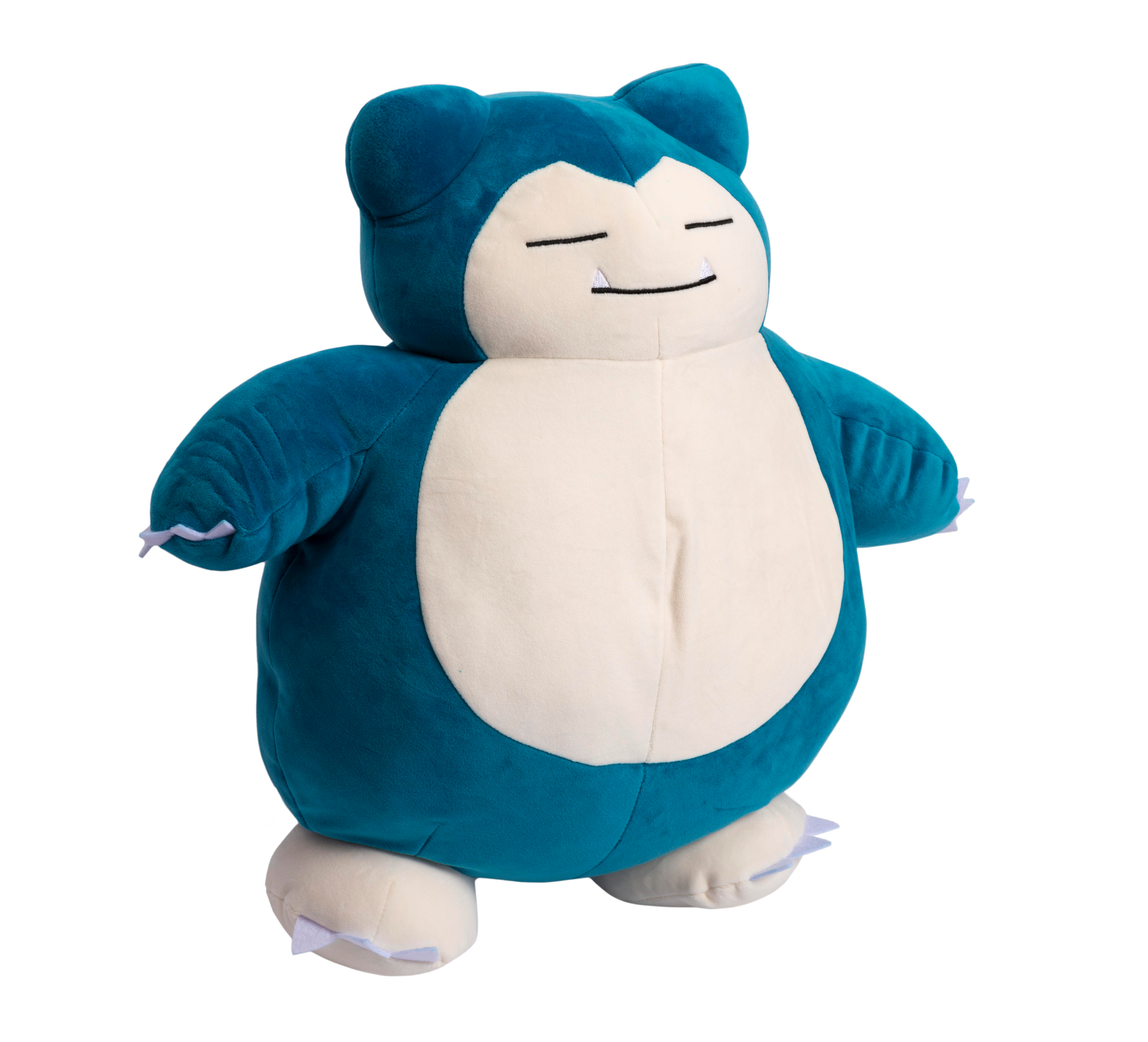Snorlax Plüschtier, blau und cremefarben. Steht auf weißem Hintergrund. Lächelt und schläft.