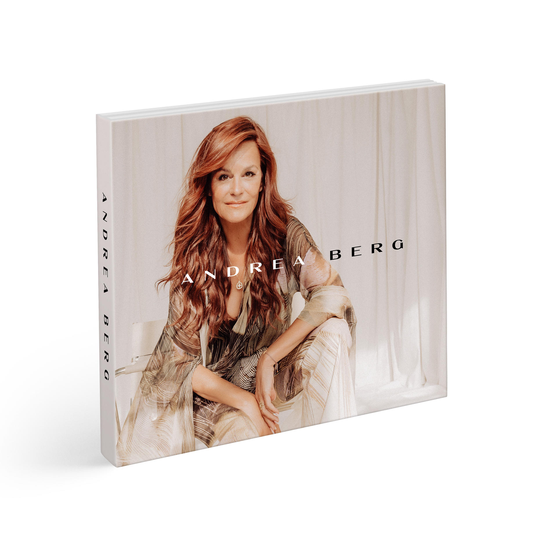 Buchcover von Andrea Berg. Das Foto zeigt eine Frau mit roten Haaren auf weißem Hintergrund.