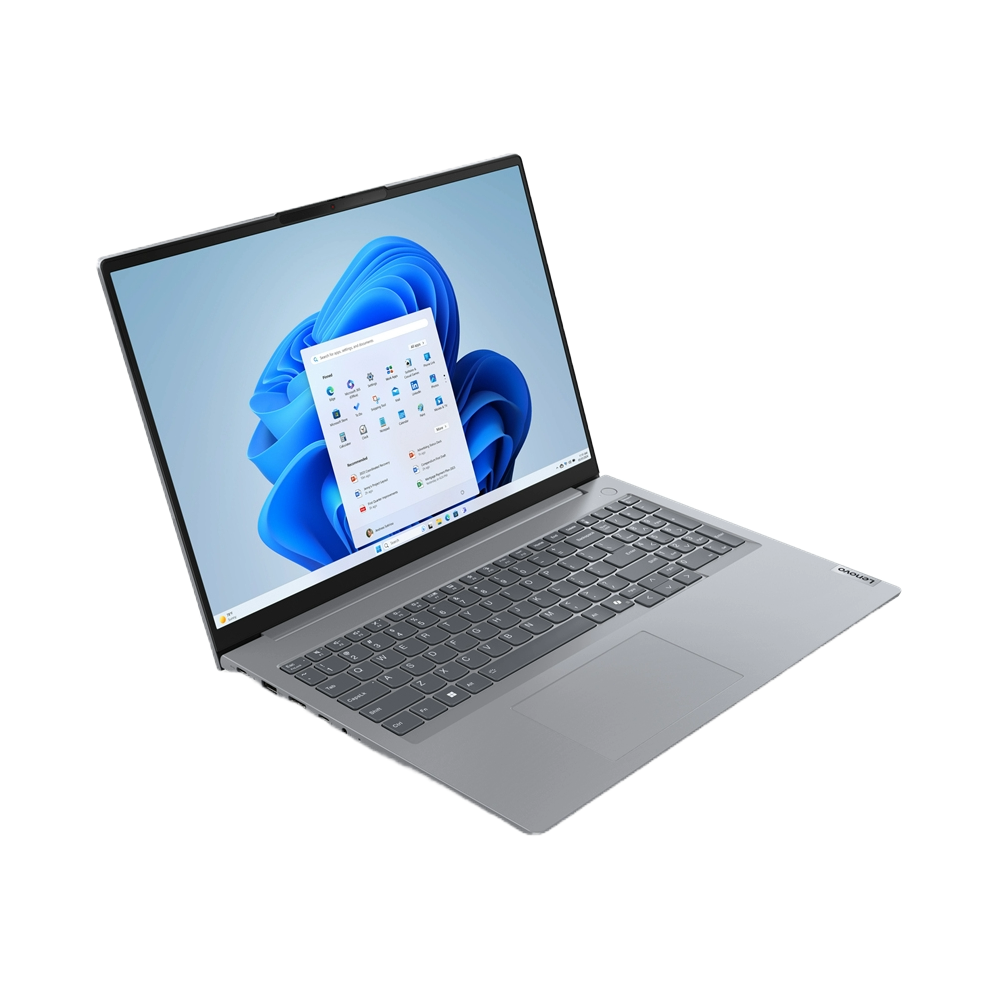 Portátil gris abierto en una mesa, mostrando pantalla Windows con iconos de aplicaciones.