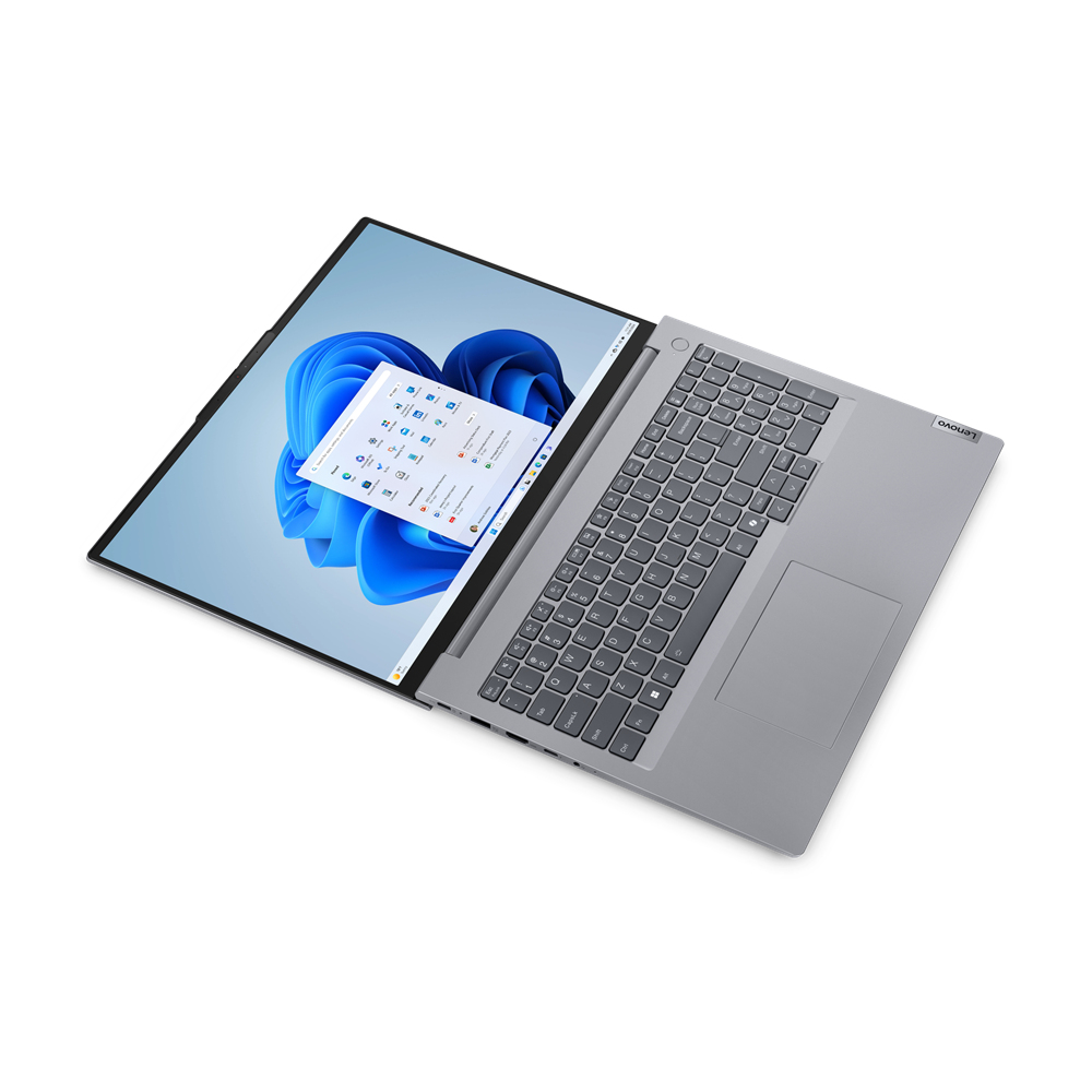 Un portátil abierto mostrando una pantalla con interfaz azul y detalles del teclado.