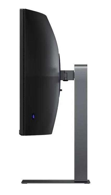 Widok z boku czarnego zakrzywionego monitora ze srebrną podstawą.