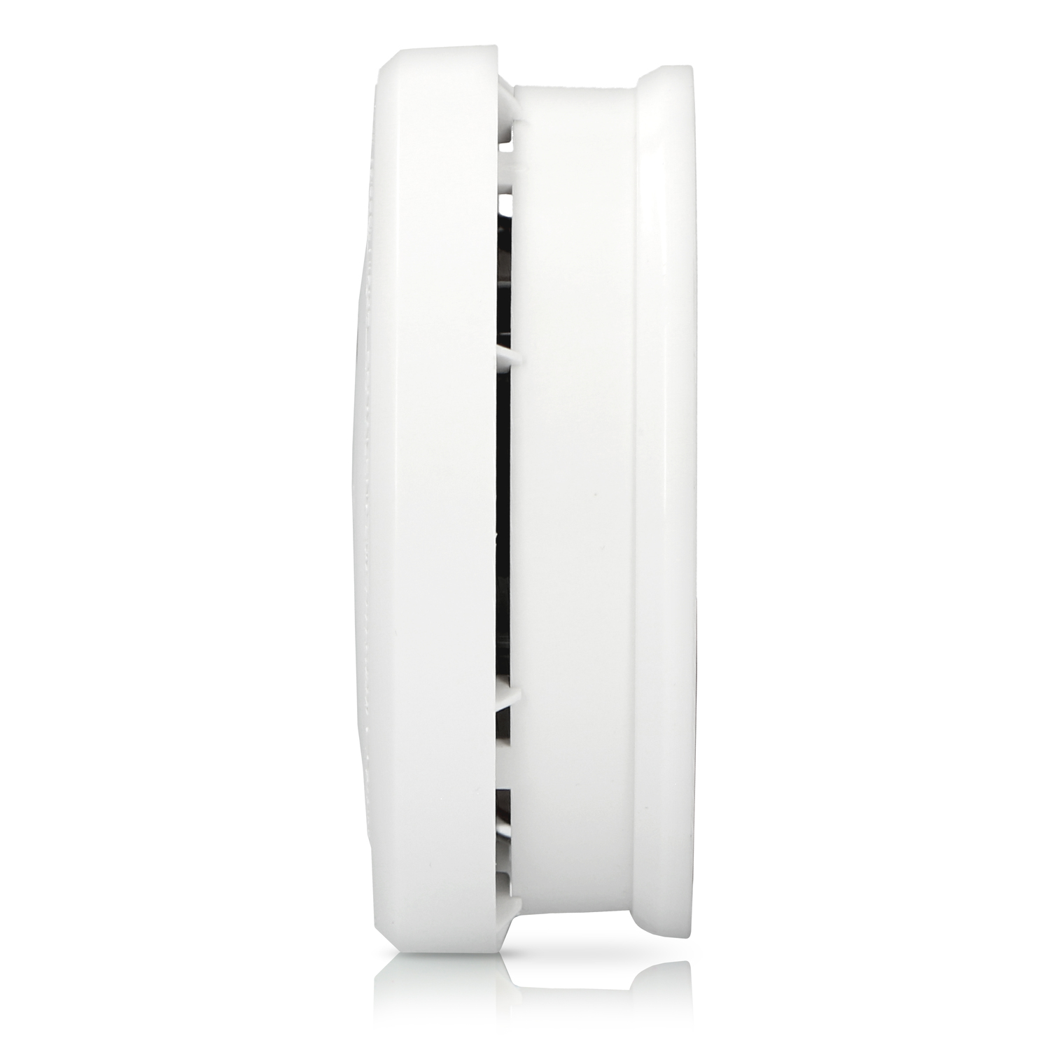 A white smoke detector from the side. It has a round shape and ventilation holes.