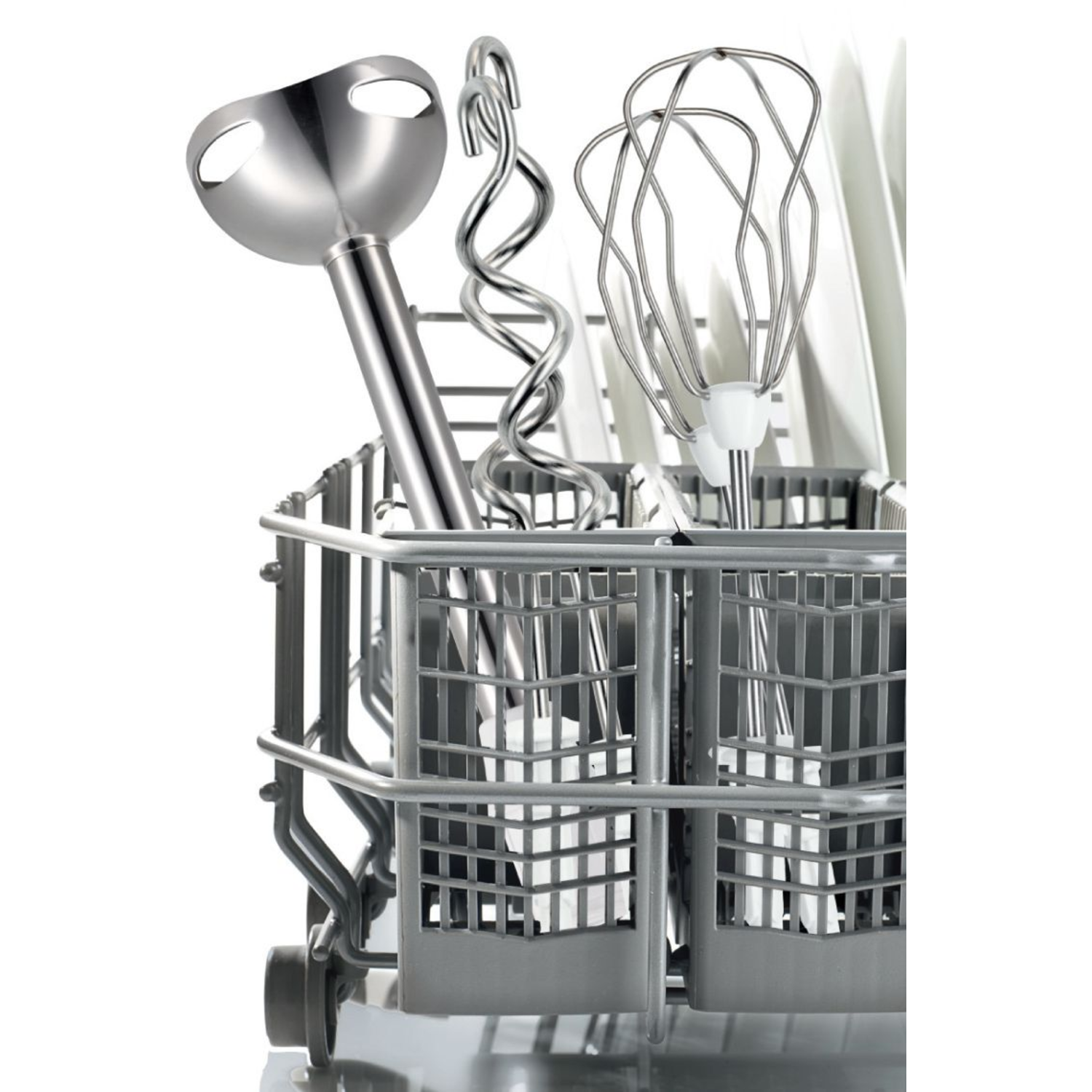 Silver blender attachments in a gray basket. Blades and wires are visible against white.
