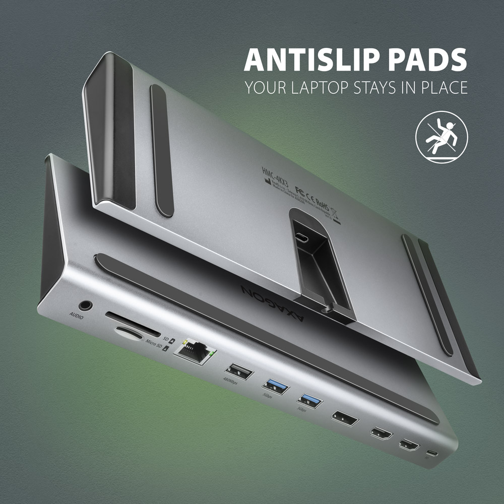 Ezüst laptop dokkoló. Több portja van, és a szöveg: 'ANTISLIP PADS YOUR LAPTOP STAYS IN PLACE'.