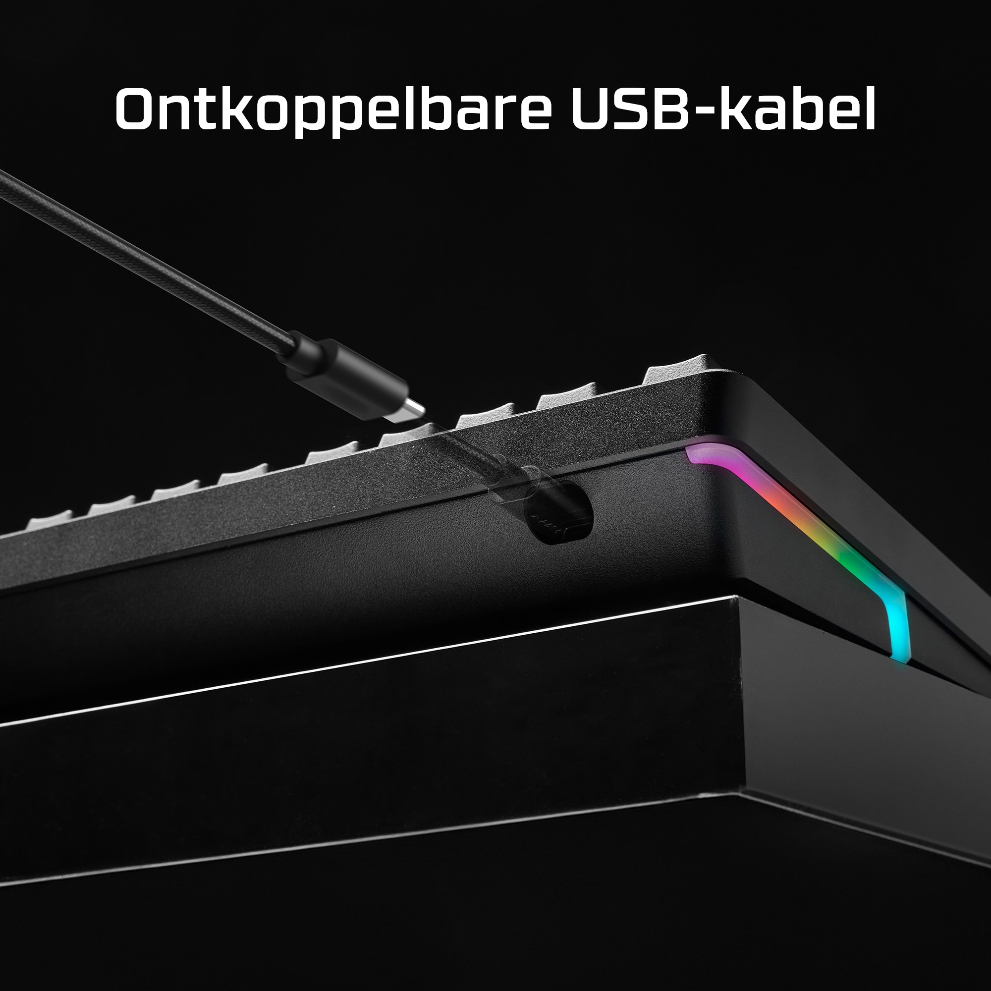 Zwarte toetsenbord zijaanzicht, USB-kabel aangesloten. Tekst: 'Ontkoppelbare USB-kabel'.