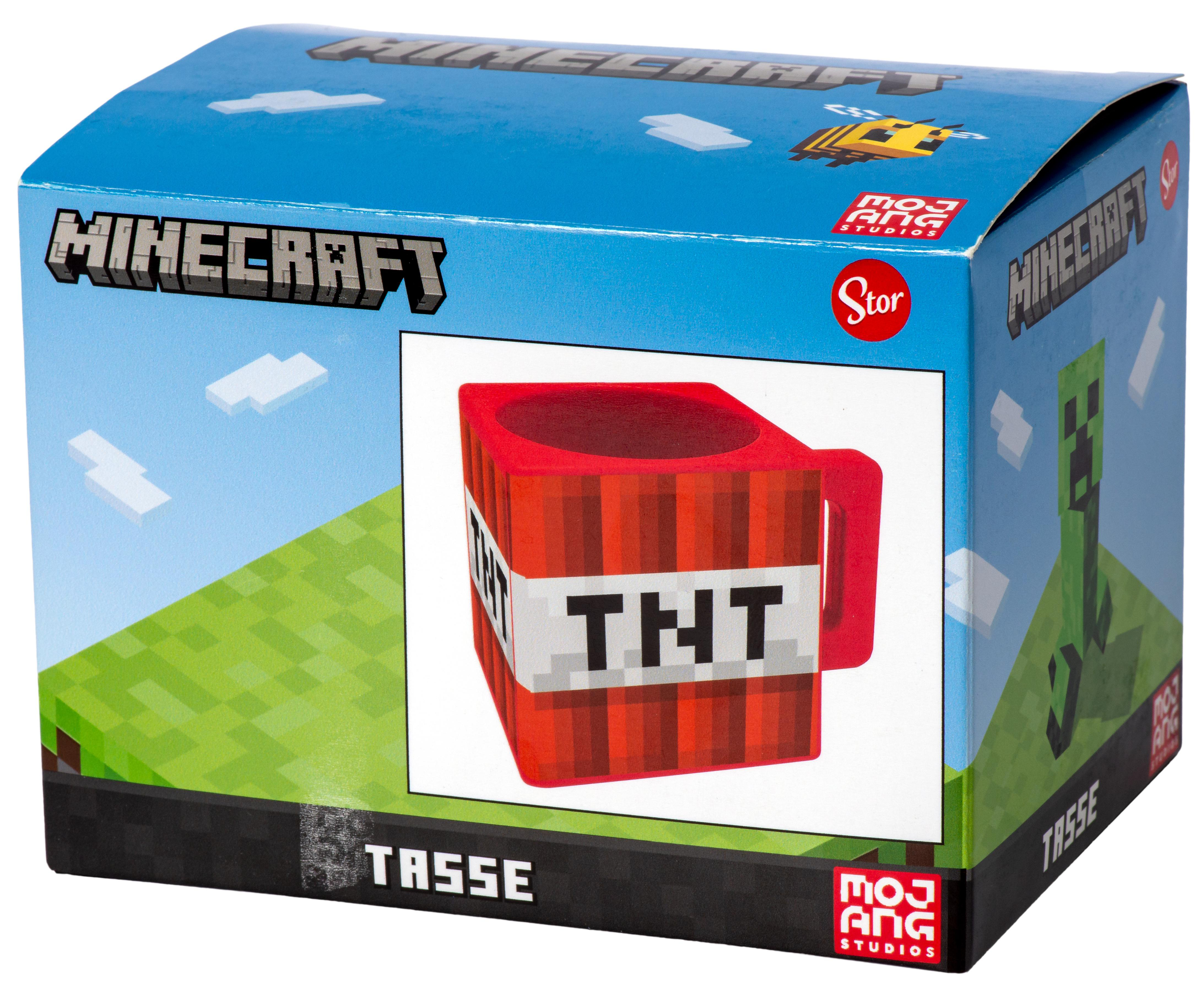 Ein Minecraft TNT-Becher steht in einer Minecraft-Box. Die Box trägt den Schriftzug Minecraft und hat einen Creeper an der Seite.