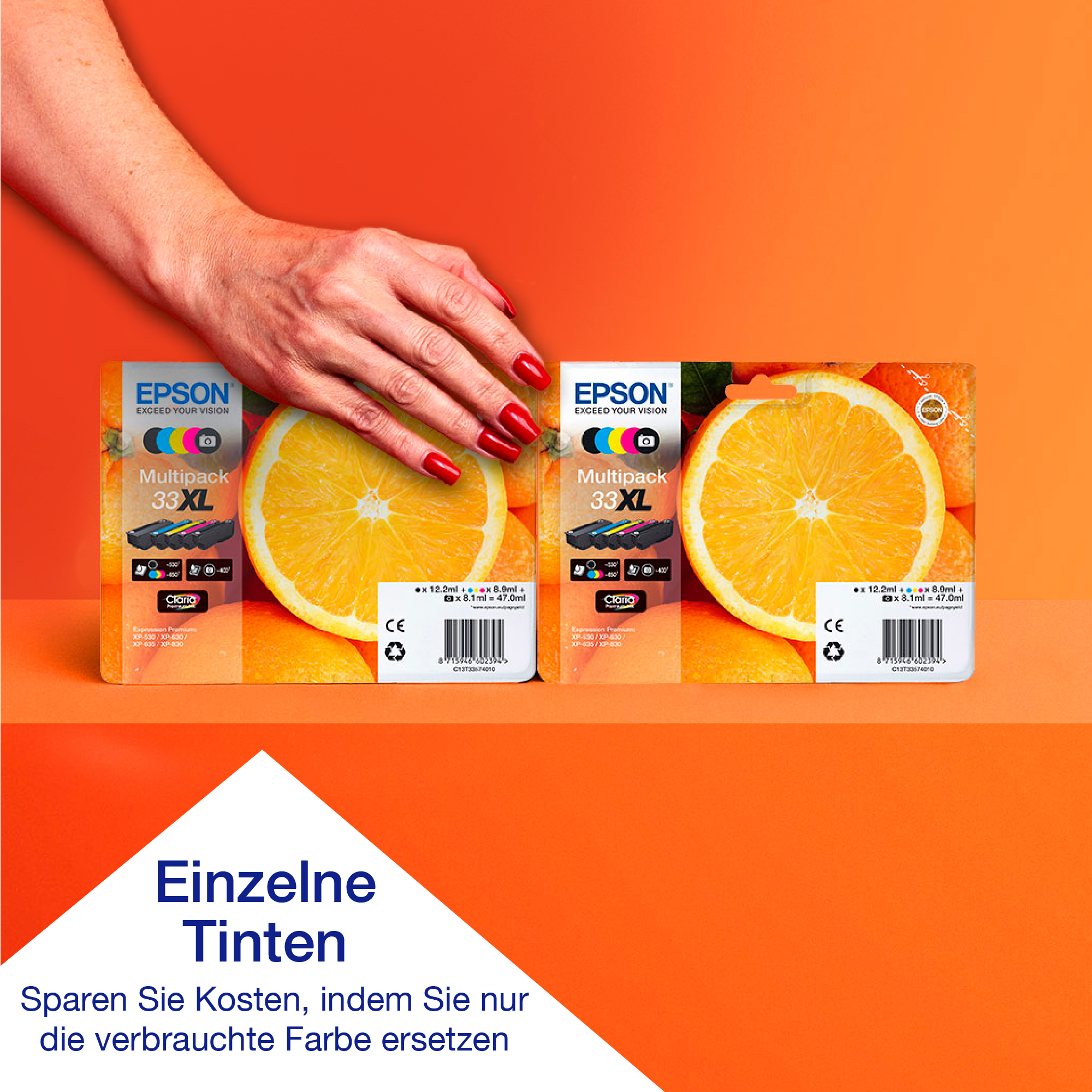 Zwei Epson-Tintenboxen, mit Orangenscheibe und Text auf Deutsch.