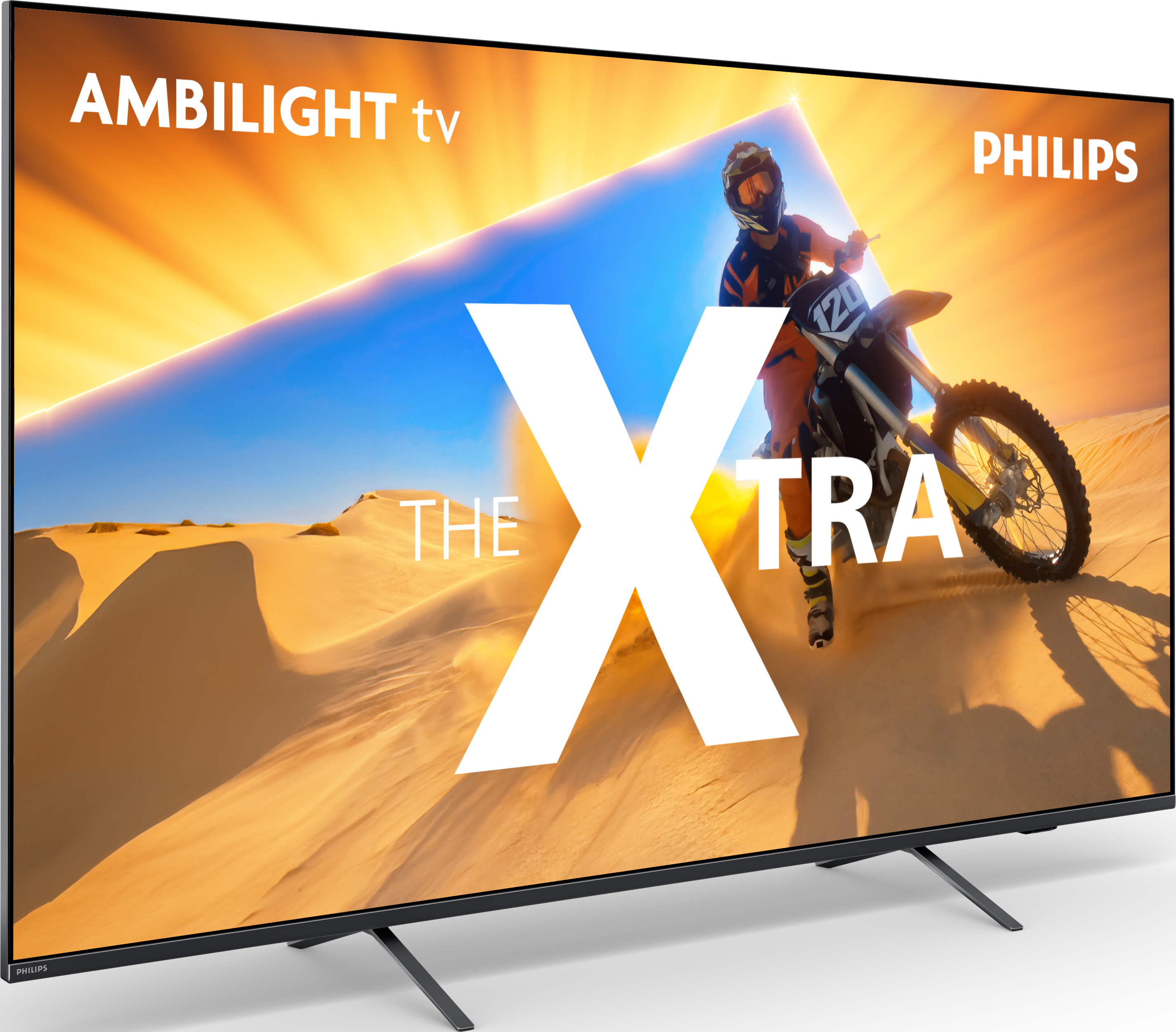 Großer Philips Ambilight TV, der eine Wüstenszene mit Motorrad zeigt. Das Wort 'Xtra' ist prominent.