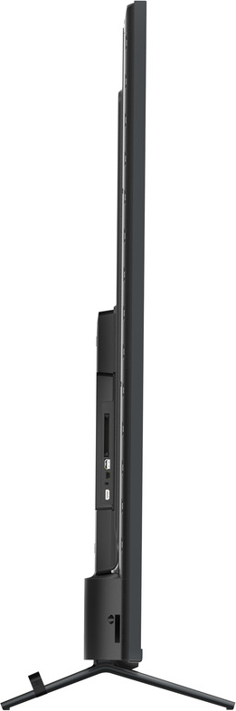 Seitenansicht eines schwarzen Fernsehers auf einem Ständer mit Anschlüssen und schlankem Design.