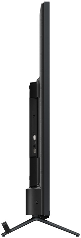 Vista laterale di una TV nera su supporto, porte visibili, design elegante.