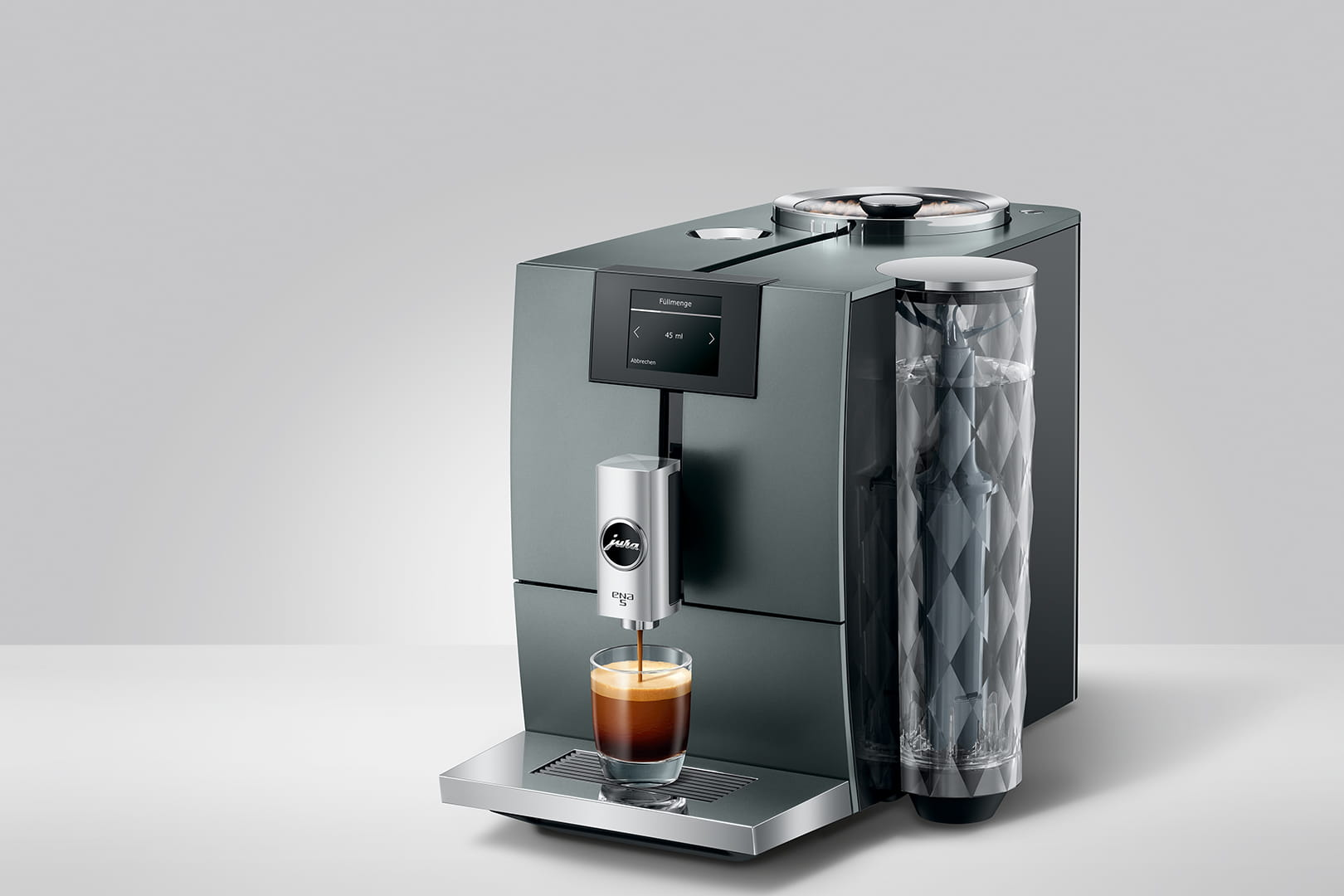 Macchina da caffè Jura E8 grigio scuro che versa espresso in un bicchiere.