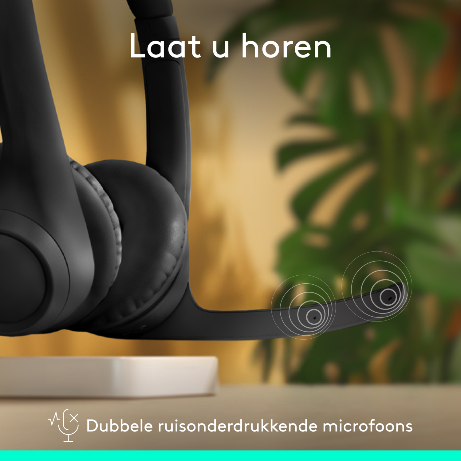 Black headset with a microphone, on a white stand. Text reads "Double noise-canceling microphones."