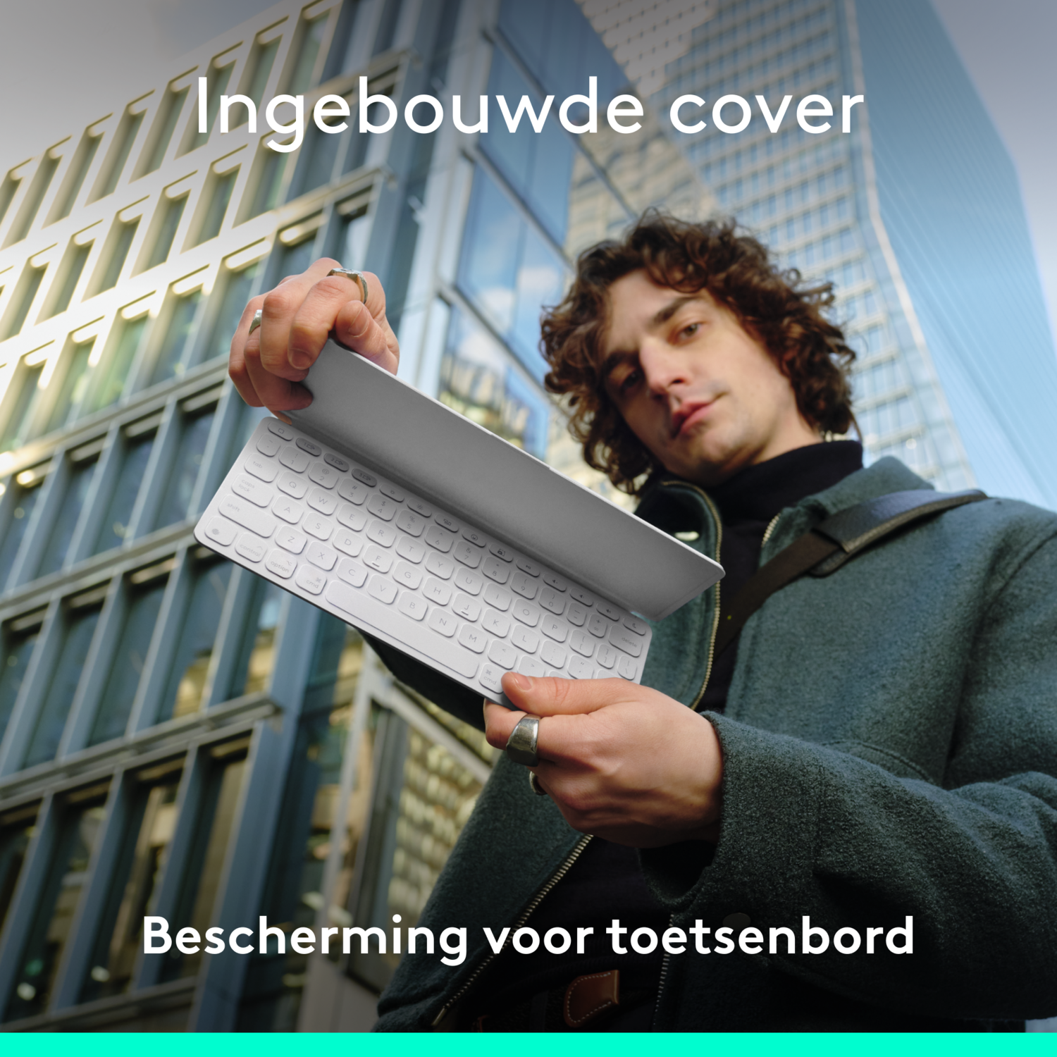 Man with white keyboard. Text: Built-in cover. Protection for keyboard.